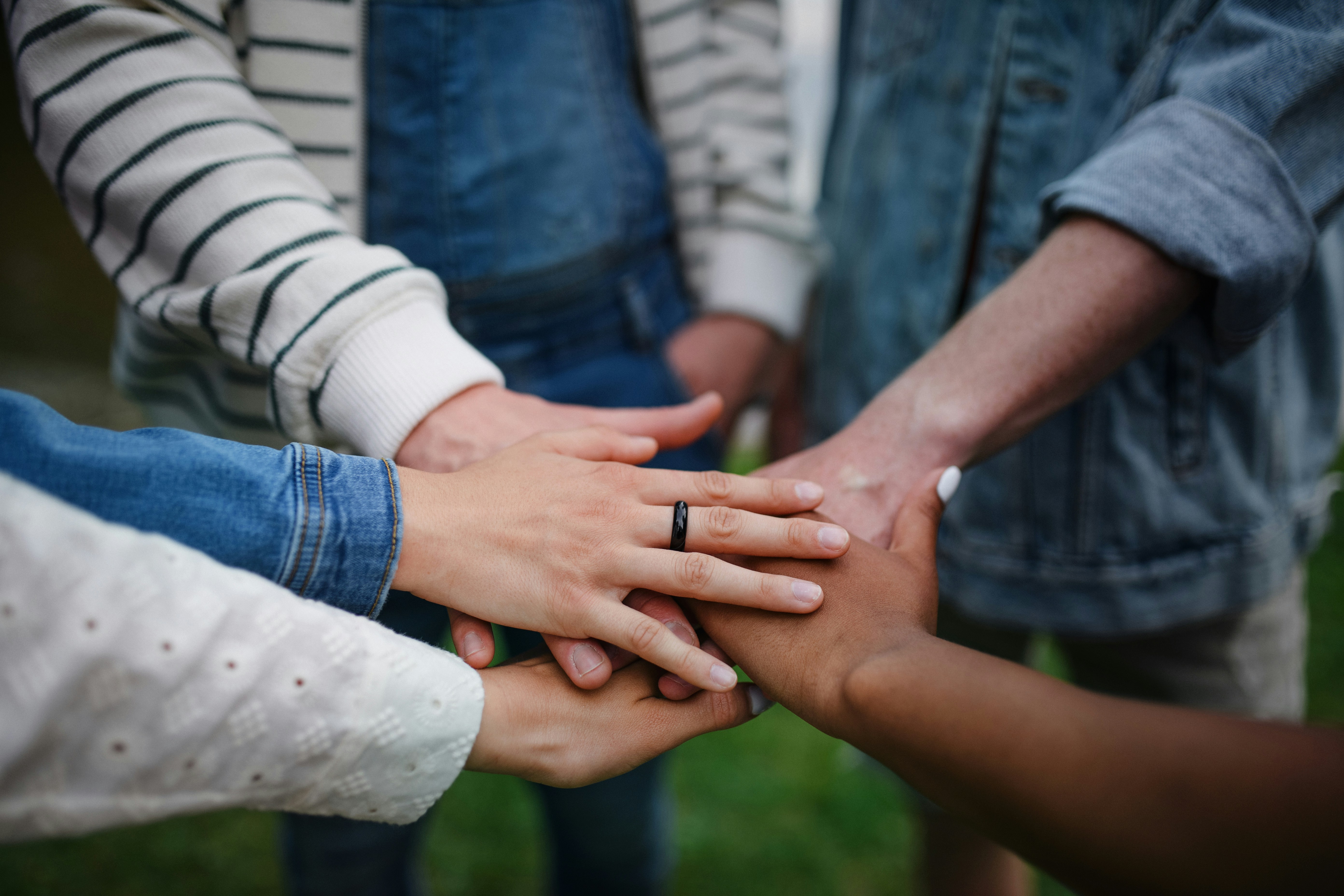 hands in center supporting each other