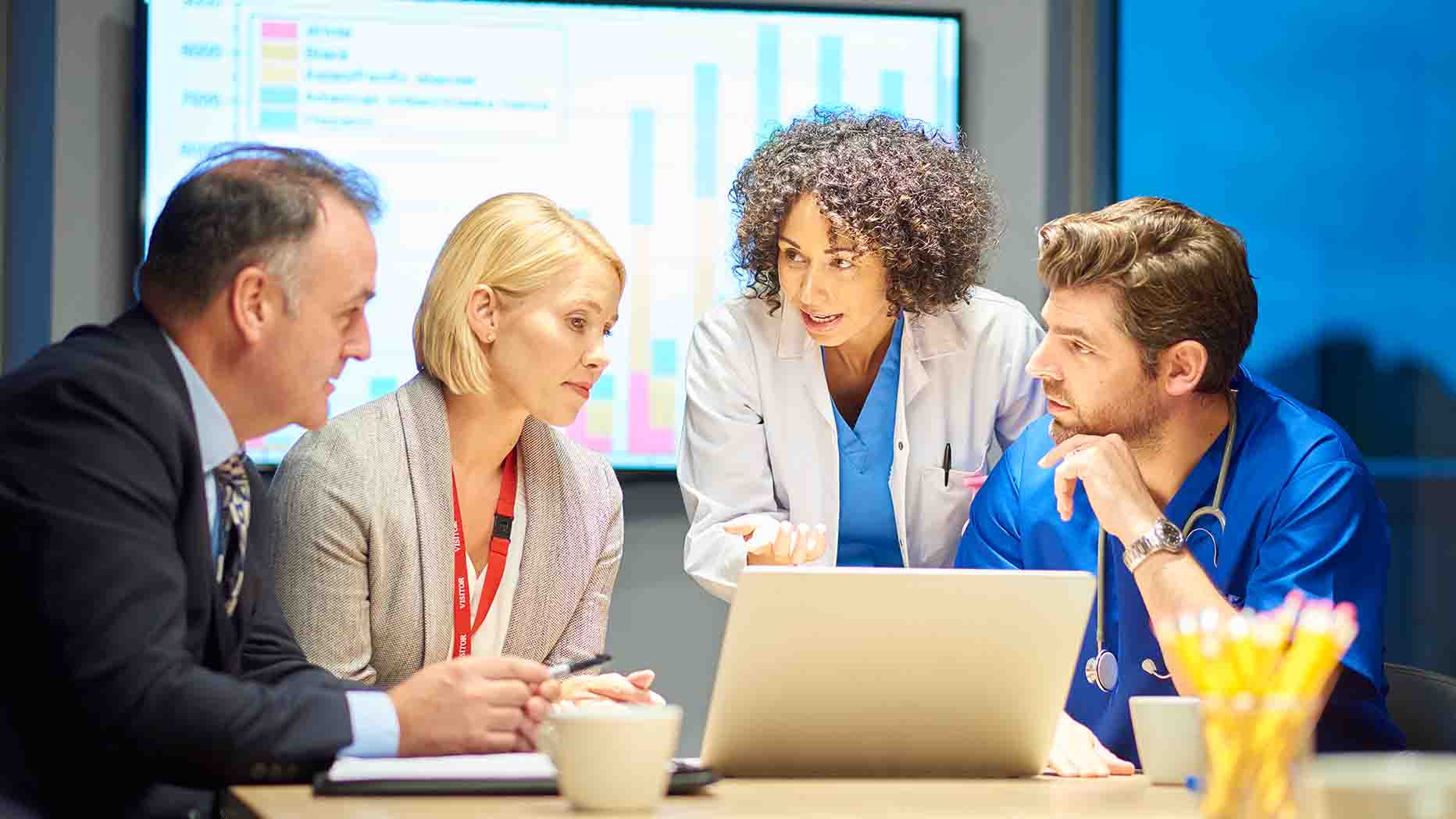 A meeting of healthcare professionals and administration leaders