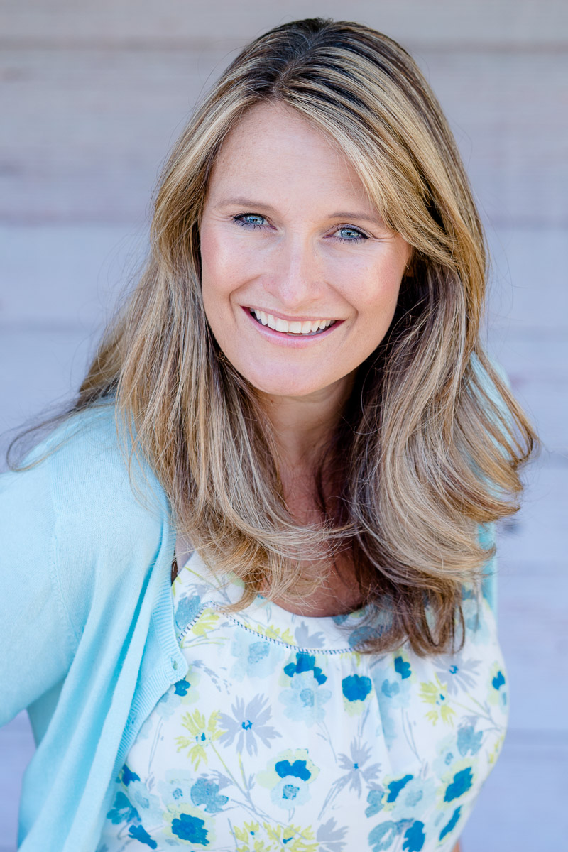Headshot of Danielle wearing blue