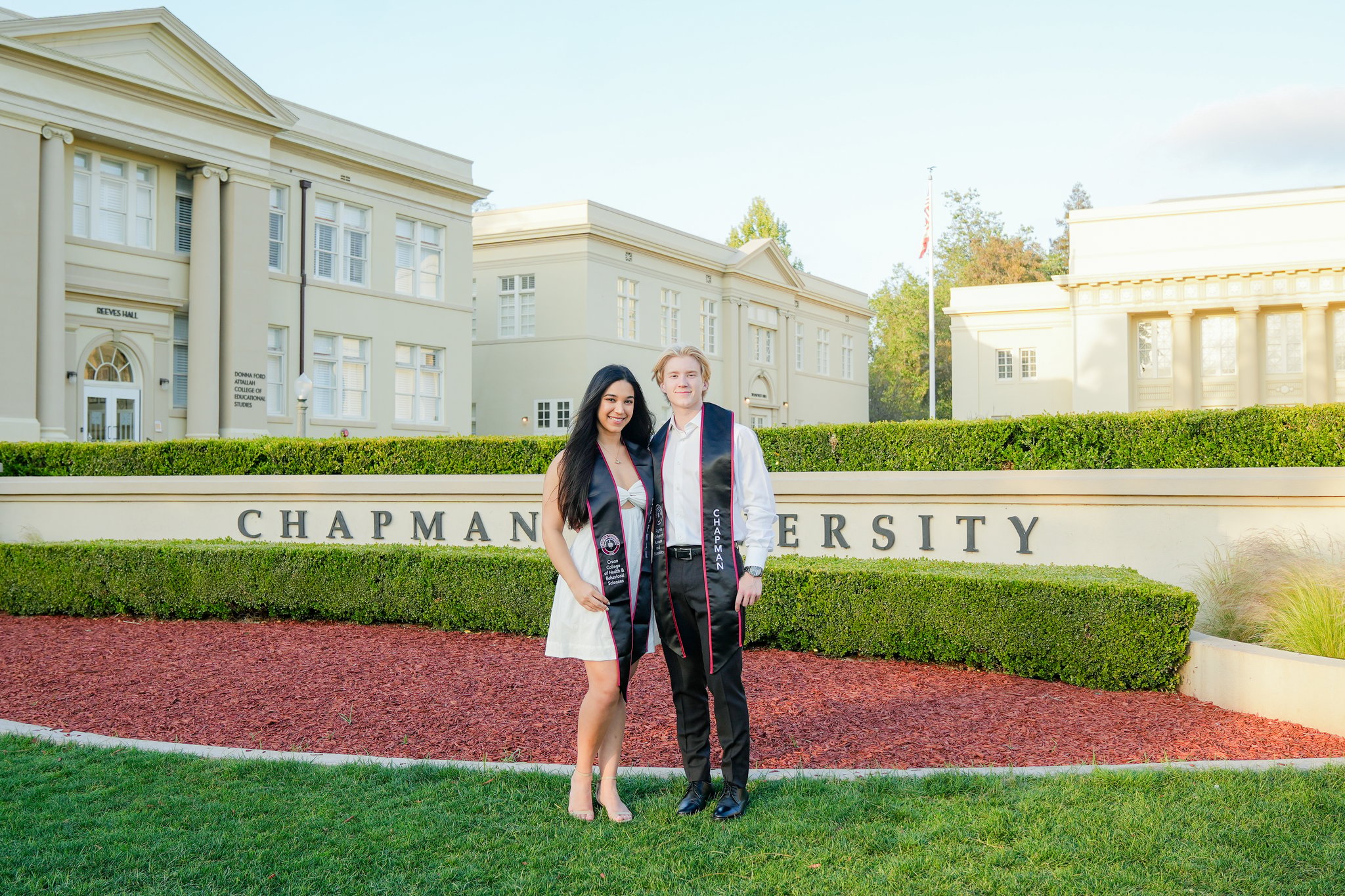 Chapman University Graduation Photos in front of university sign