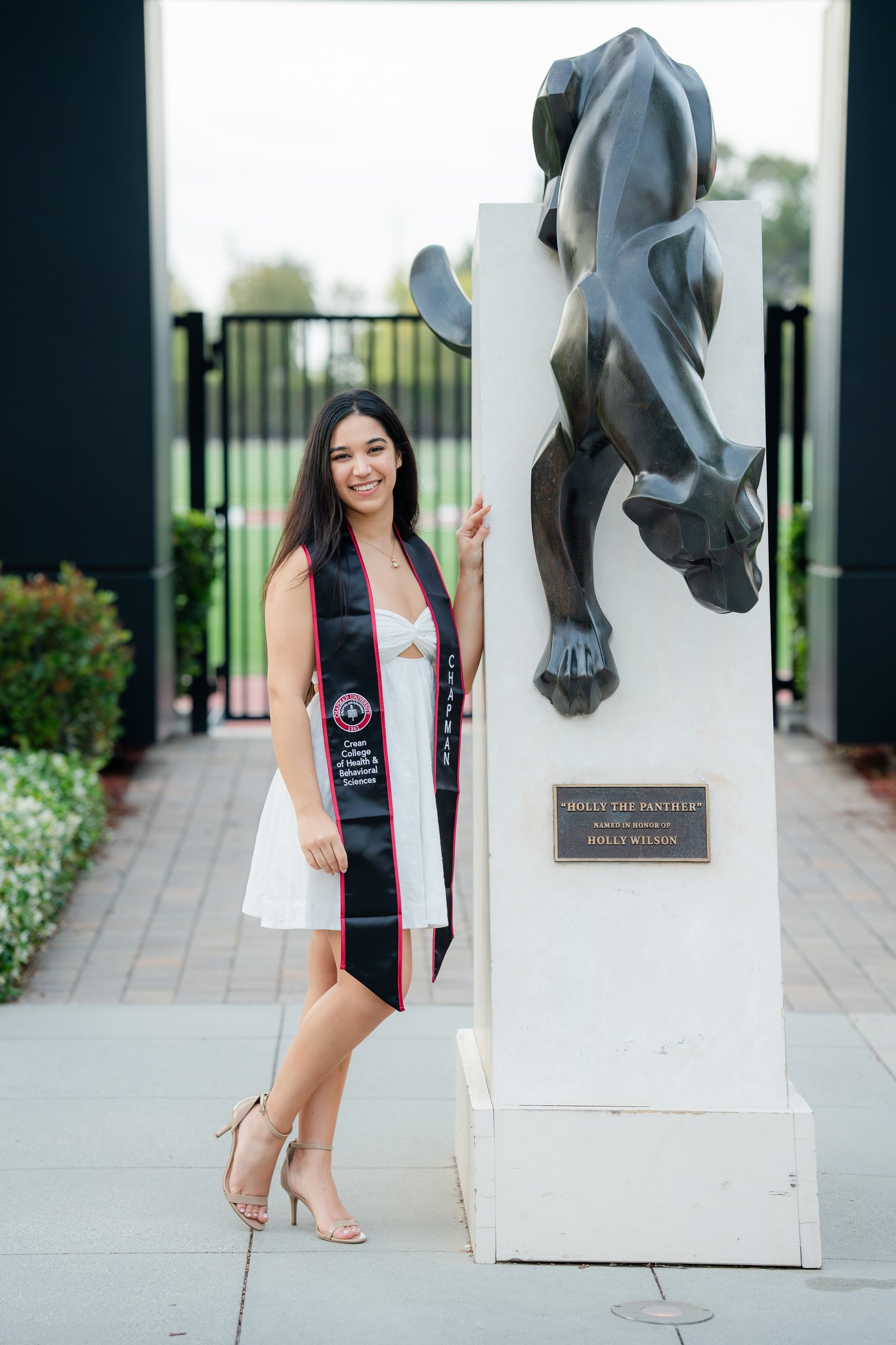 Chapman University Graduation Photo in front of Panther Mascot