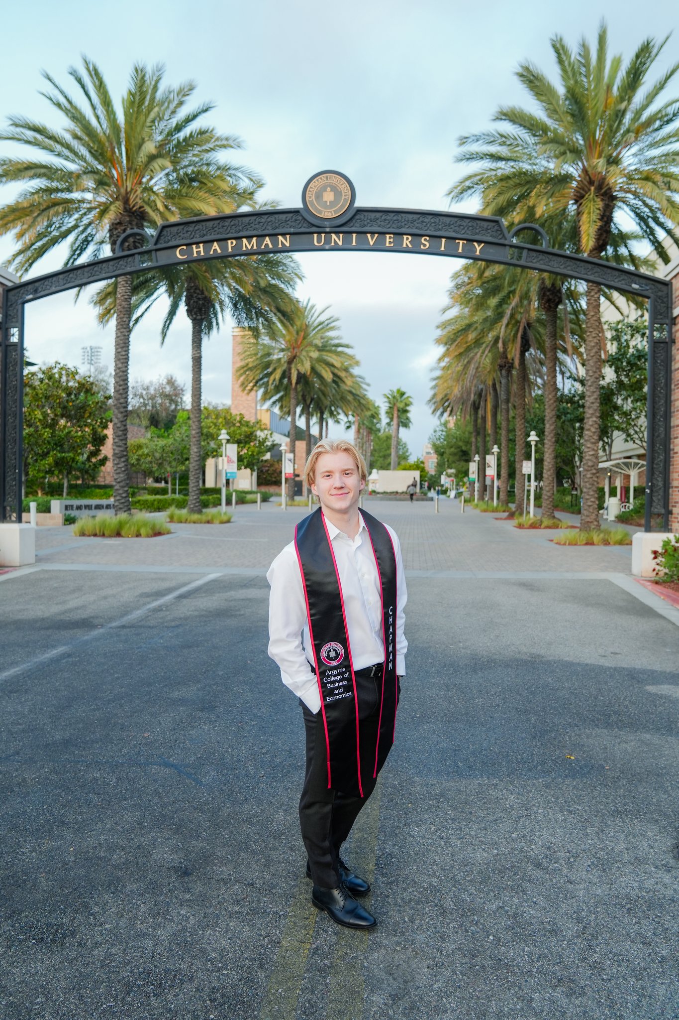 Chapman University Graduation Photo in front of Chapman sign