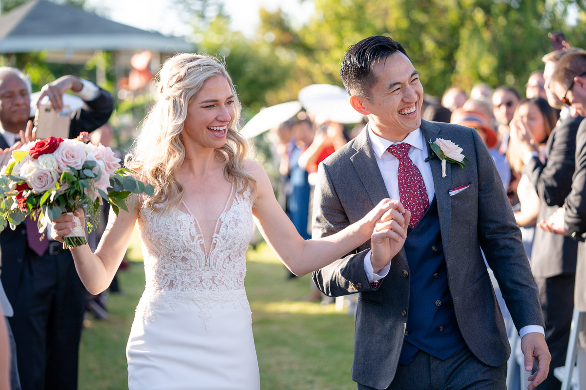 wedding couple walks down the aisle