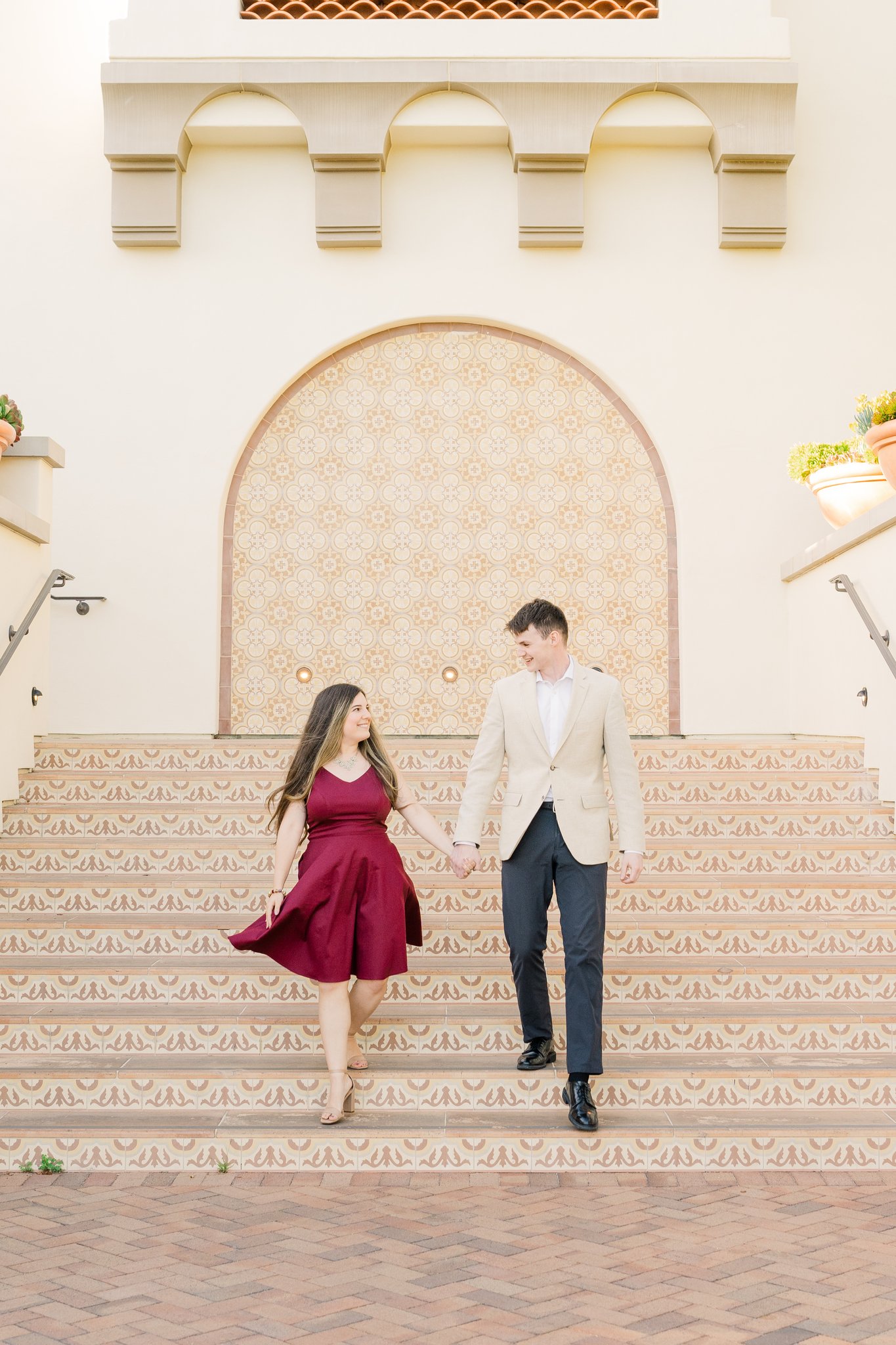 engagement photos couple in burgundy dress 