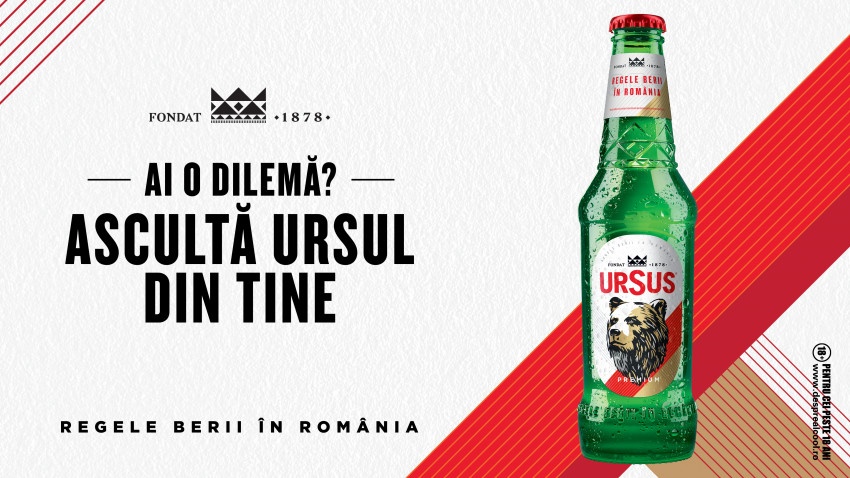 Botella de cerveza Ursus junto a texto publicitario en rumano