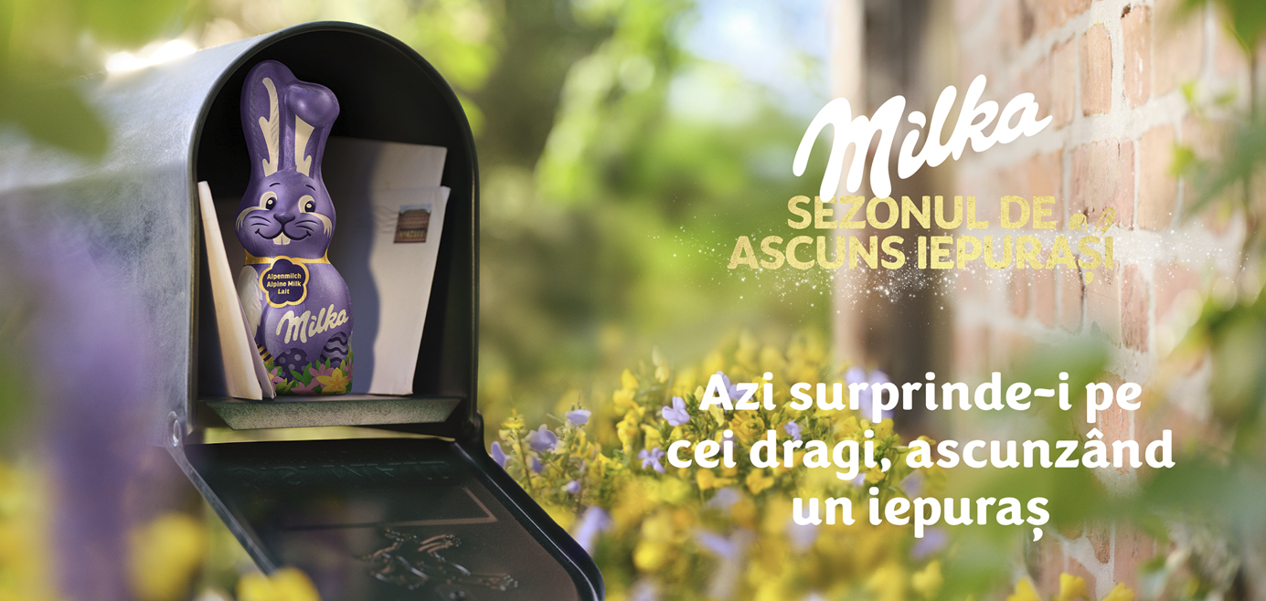 Barra de chocolate Milka en una caja de regalo abierta con texto de Pascua