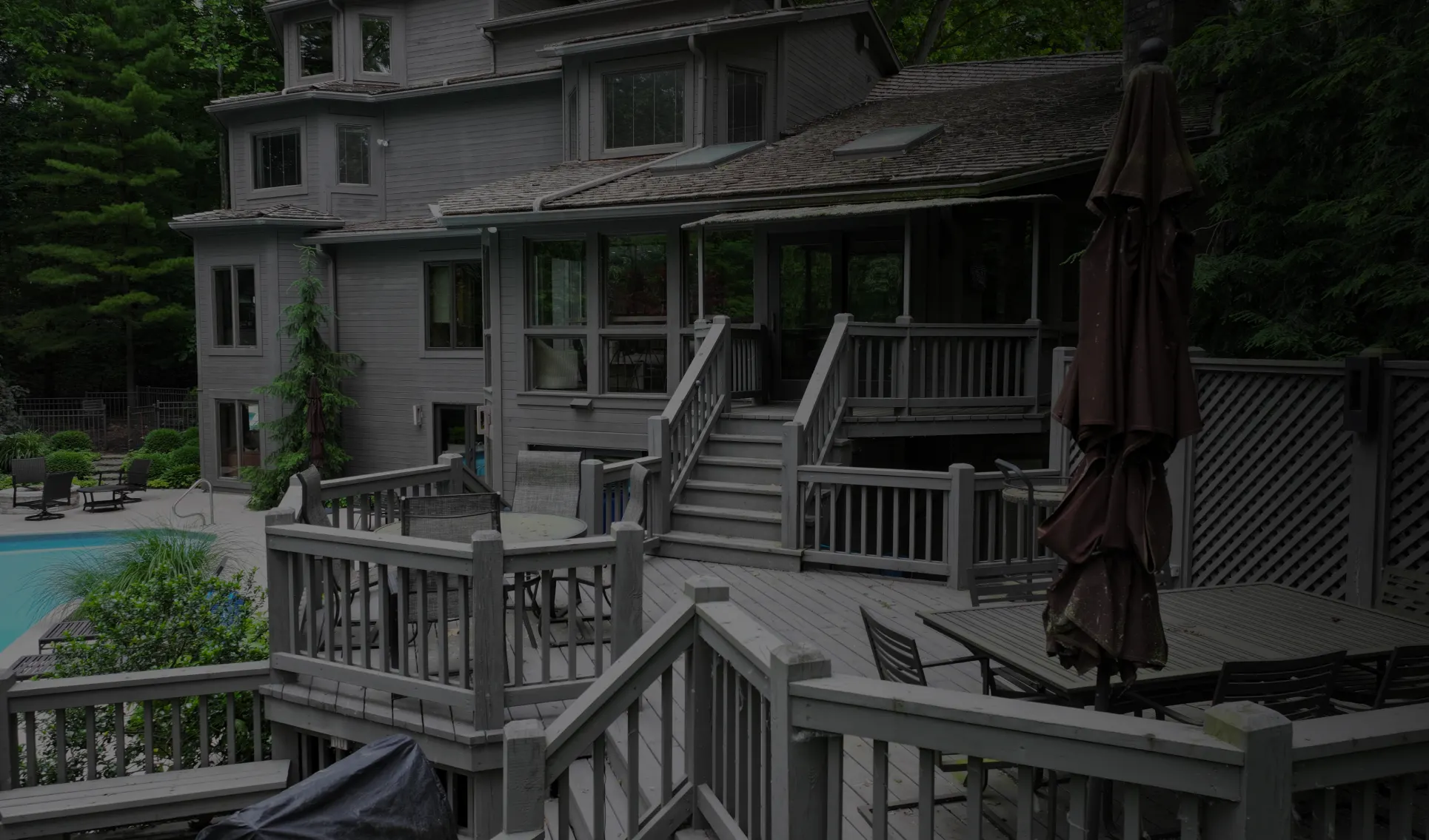 back deck of home with in-ground pool