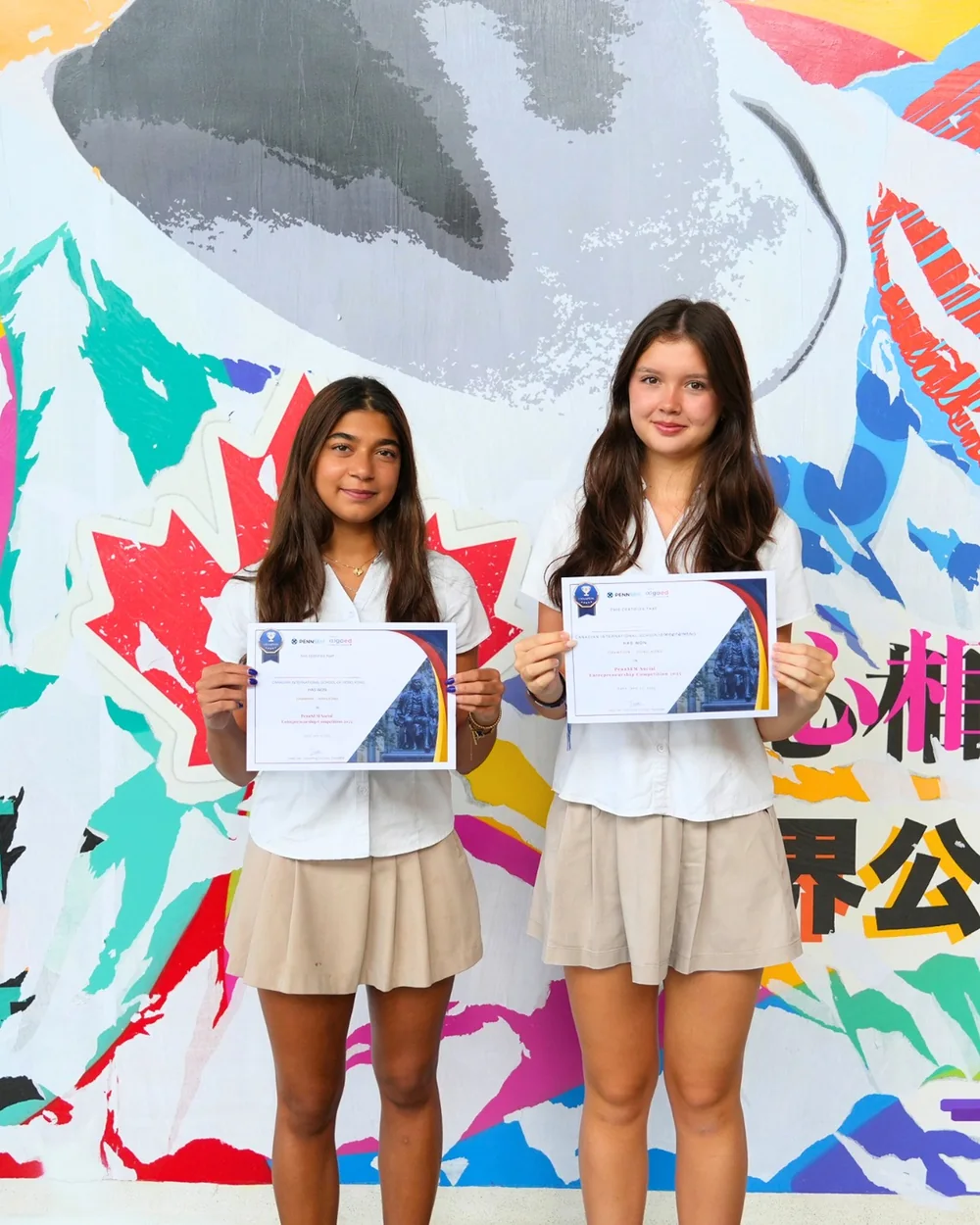 Canadian International School students holding certificates