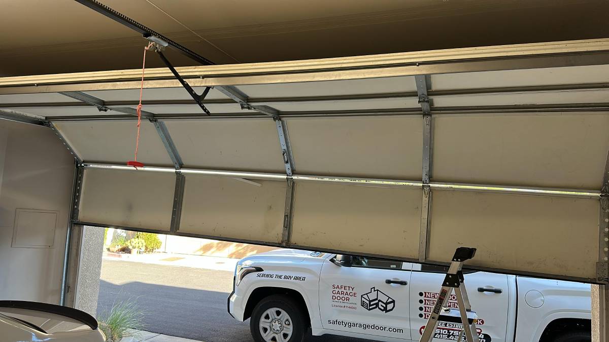 Garage door opening with remote control.