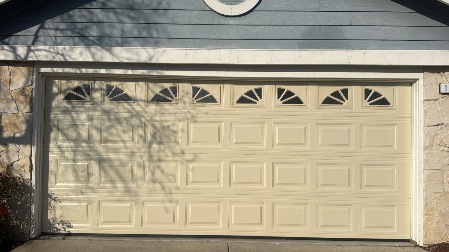 An upscale home with a double-door garage