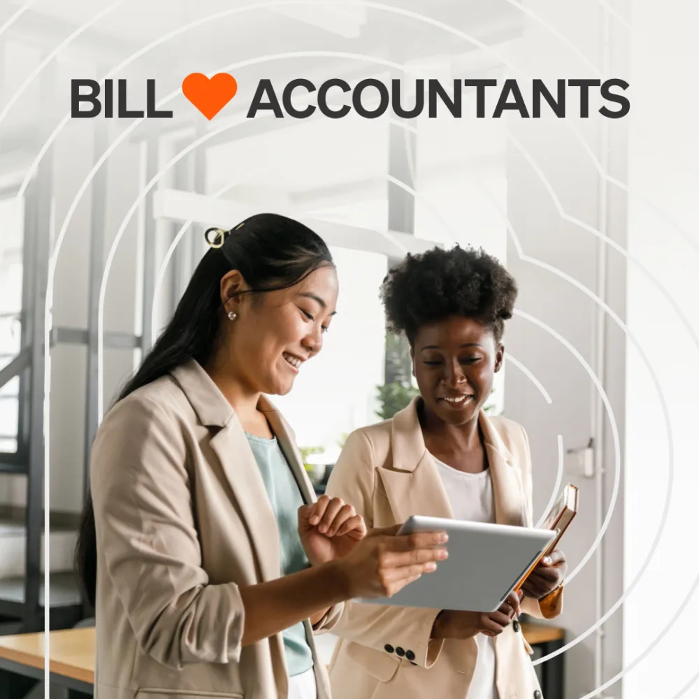 Two women in business attire smiling and looking at a tablet, with text "BILL ❤️ ACCOUNTANTS" above them.