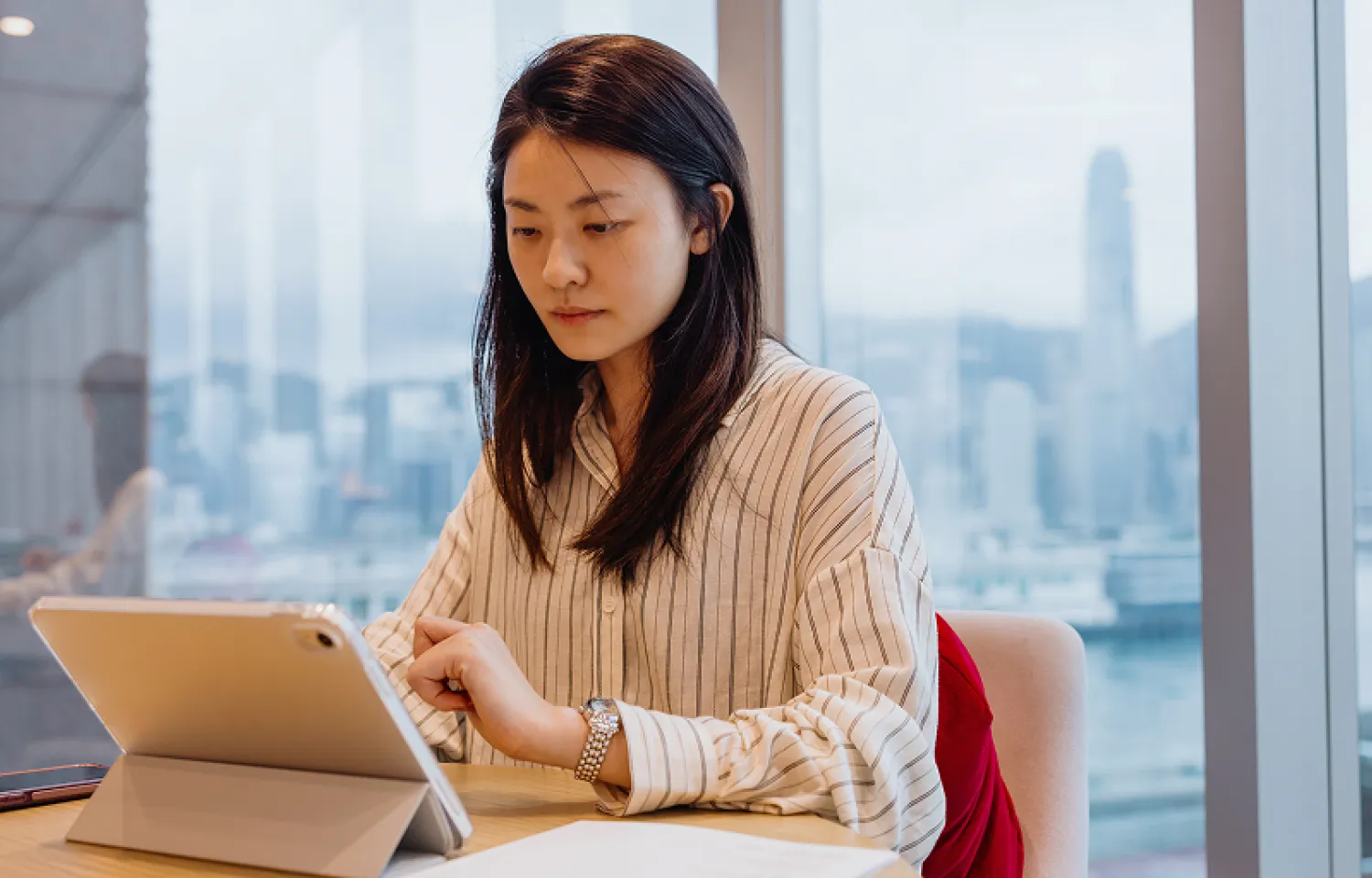 Two women looking at a piece of paper