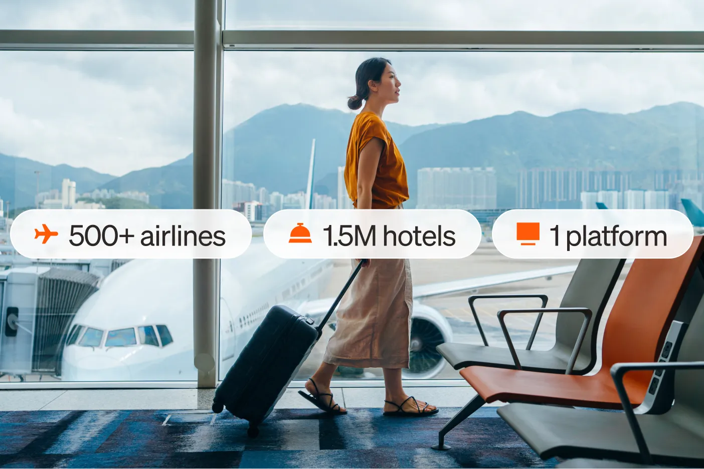 A woman in an airport pulls a suitcase in front of large windows, "500+ airlines", "1.5M hotels", and "1 platform" are overlaid.