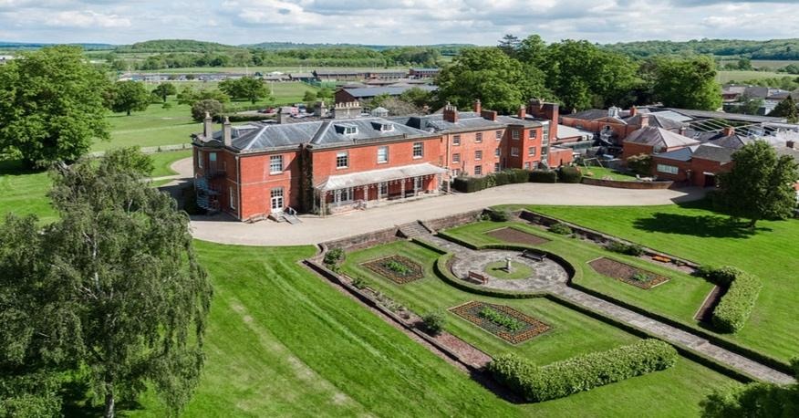 A large building with a garden in the middleAI-generated content may be incorrect.