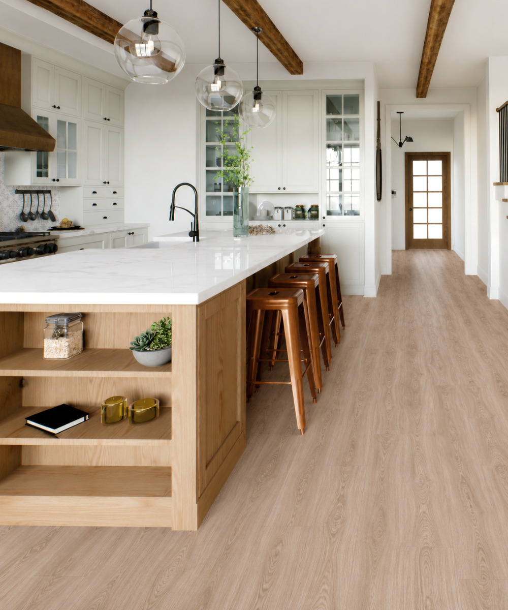 Luxury vinyl tile flooring in a bright kitchen with white cabinetry, wood island, and exposed ceiling beams
