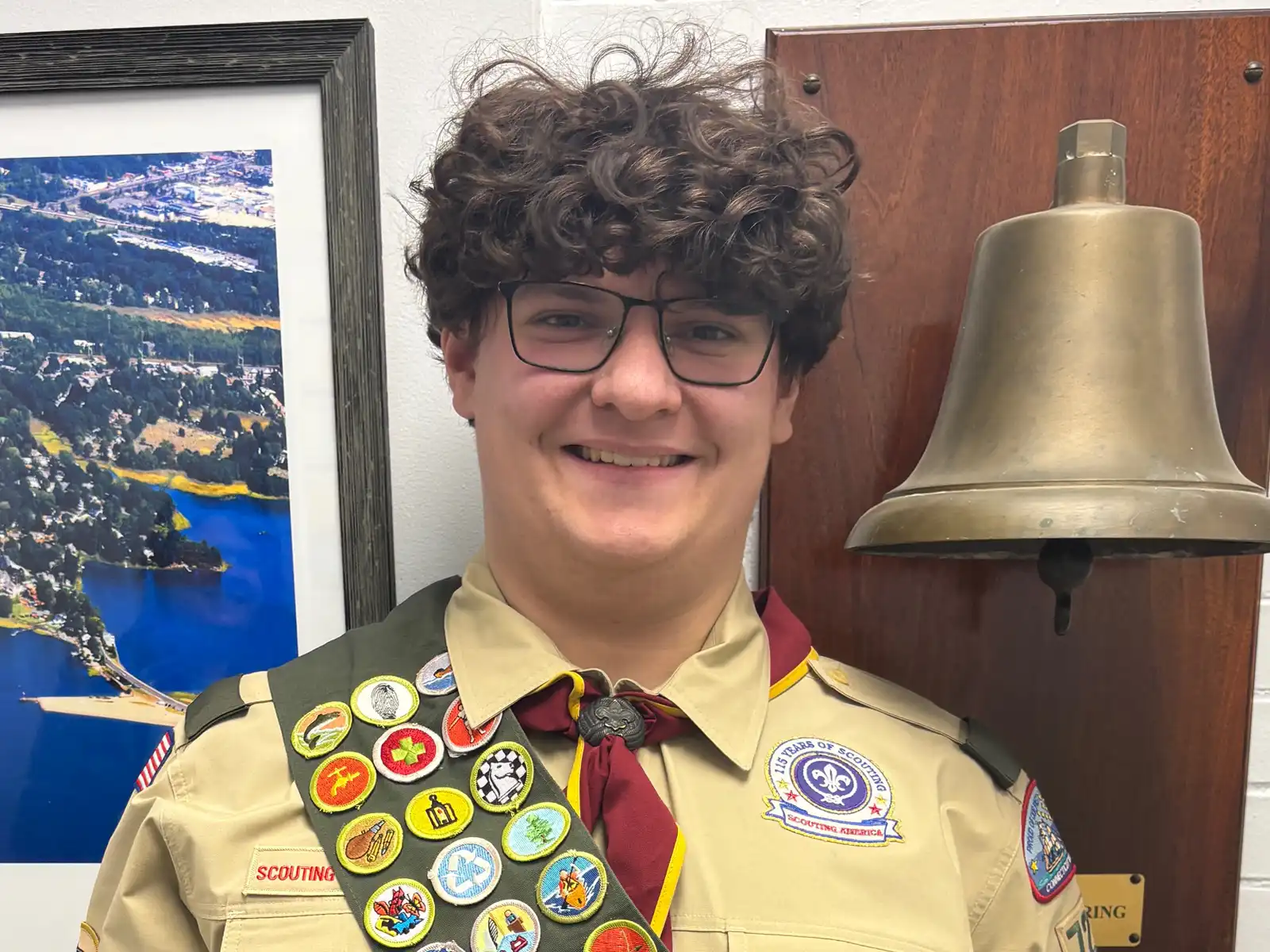 A smiling William Boyle, Eagle Scout wearing his full uniform and merit badge sash