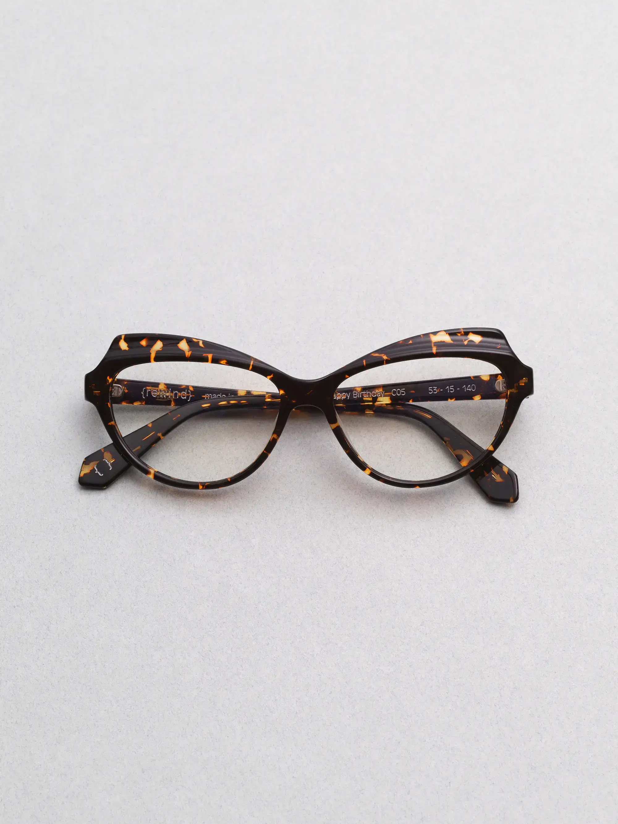 Rewind Eyewear Happy Birthday, cat-eye frame inspired by 1990s Italian design, still life photography