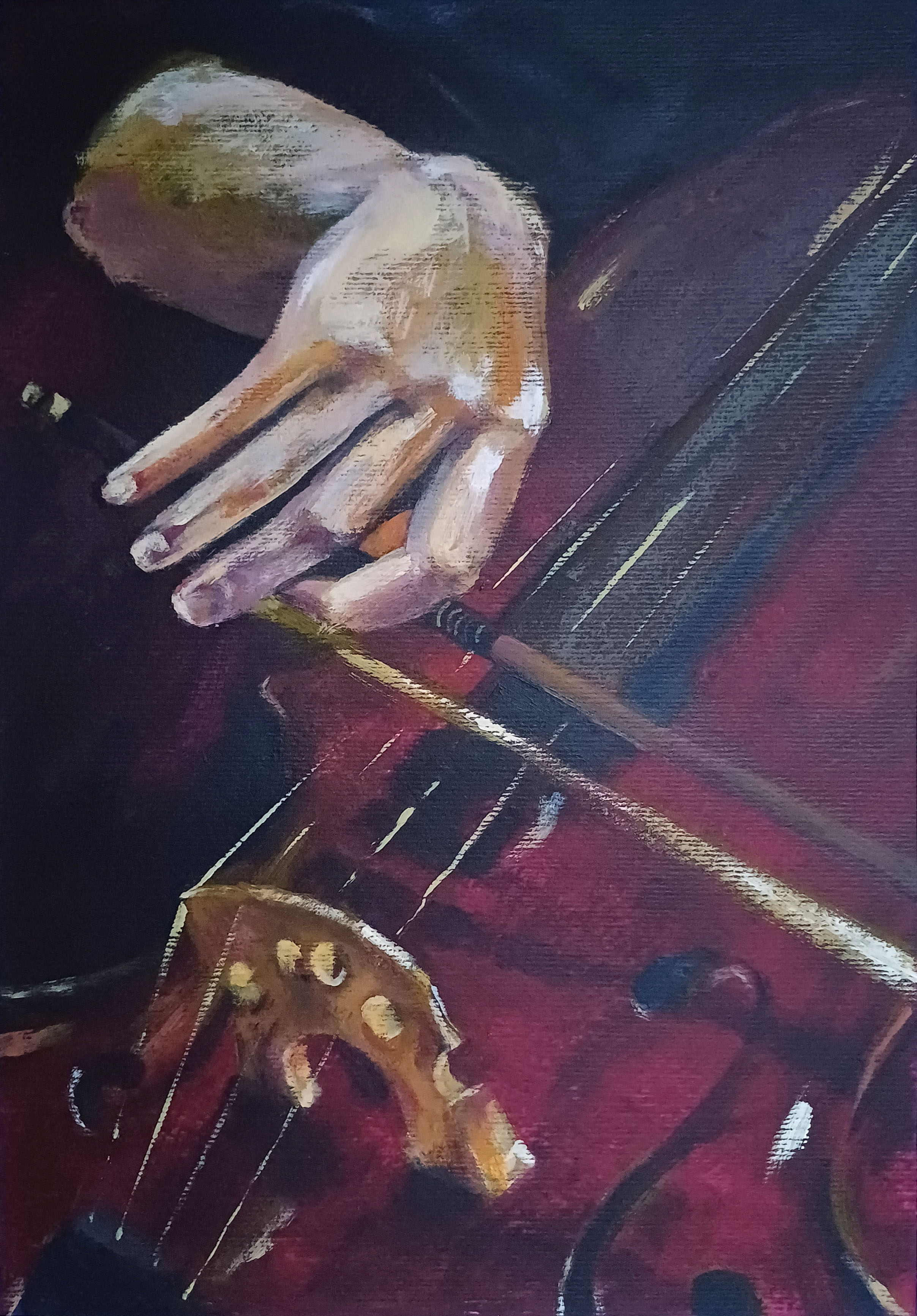 A female hand playing the bass