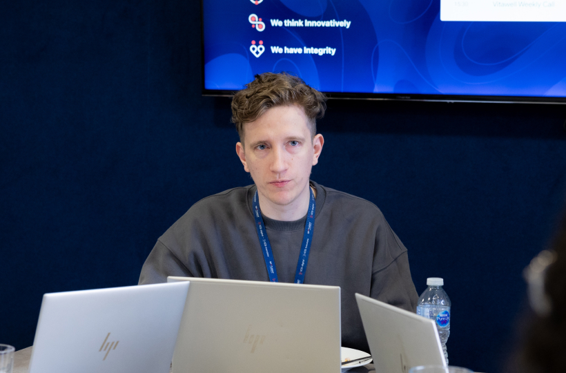 ICS-translate team member working in front of the company values screen