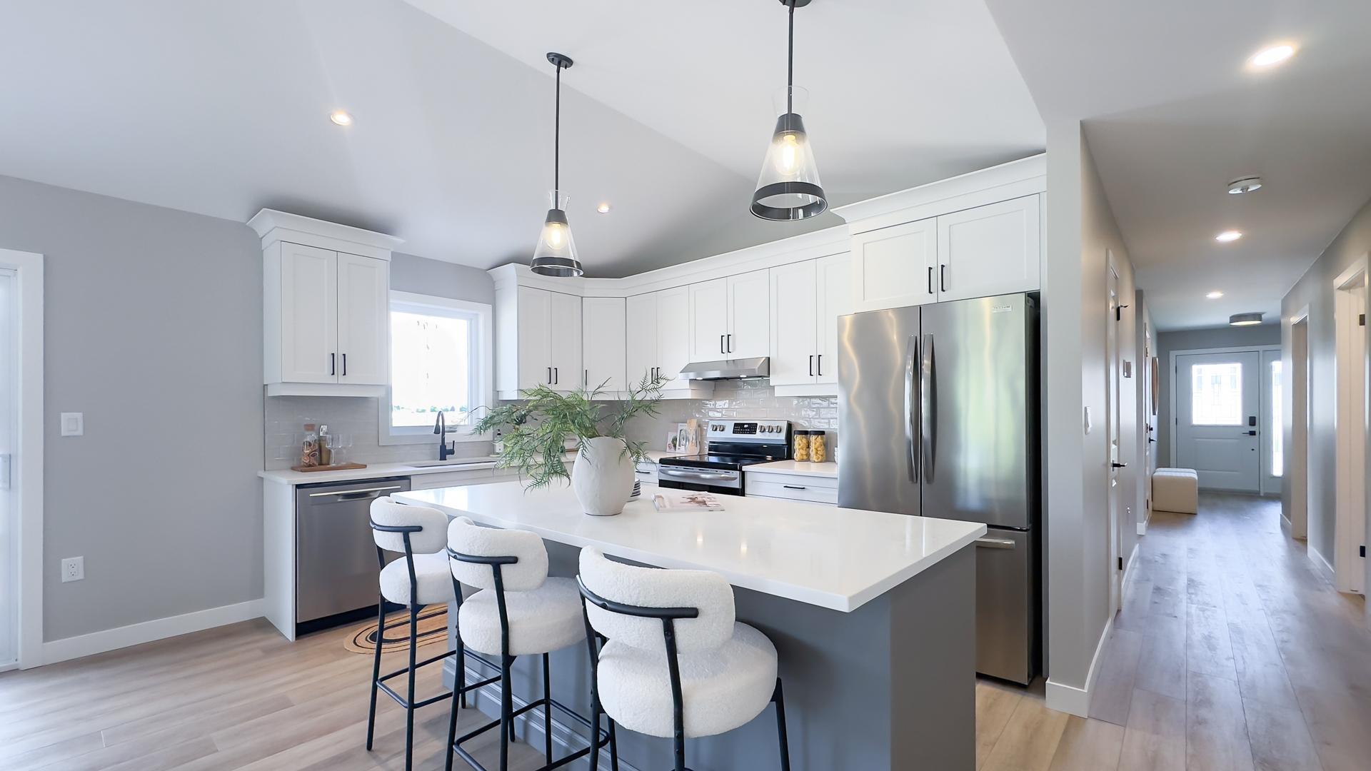 Modern kitchen with large island and quartz countertops