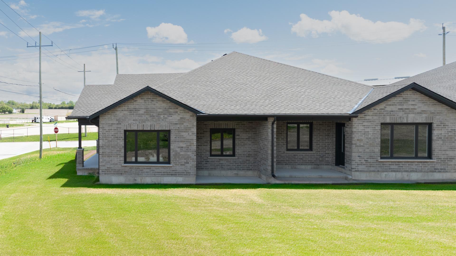 Thornden custom home exterior with stone and siding