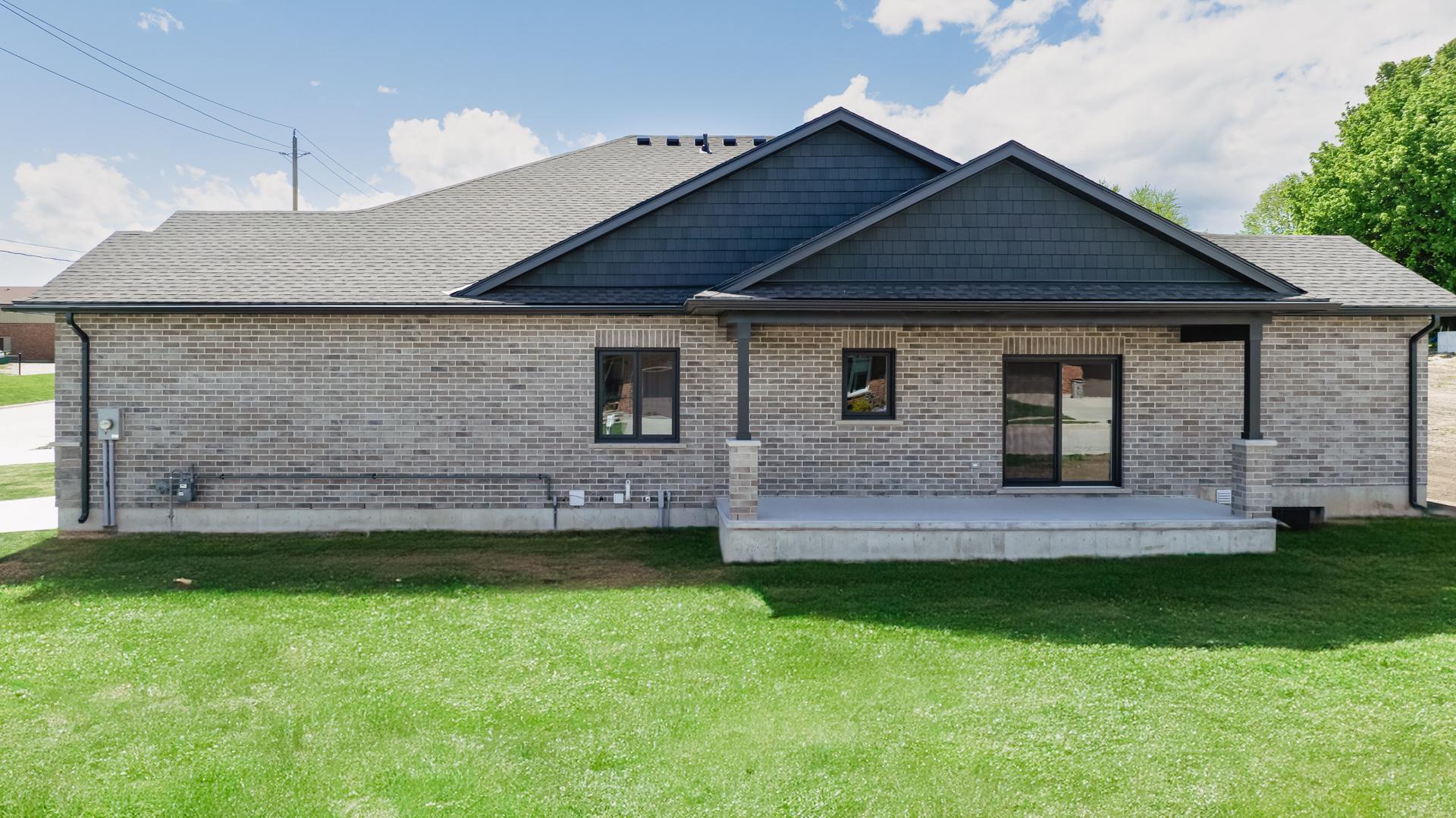 Thornden custom home exterior with stone and siding