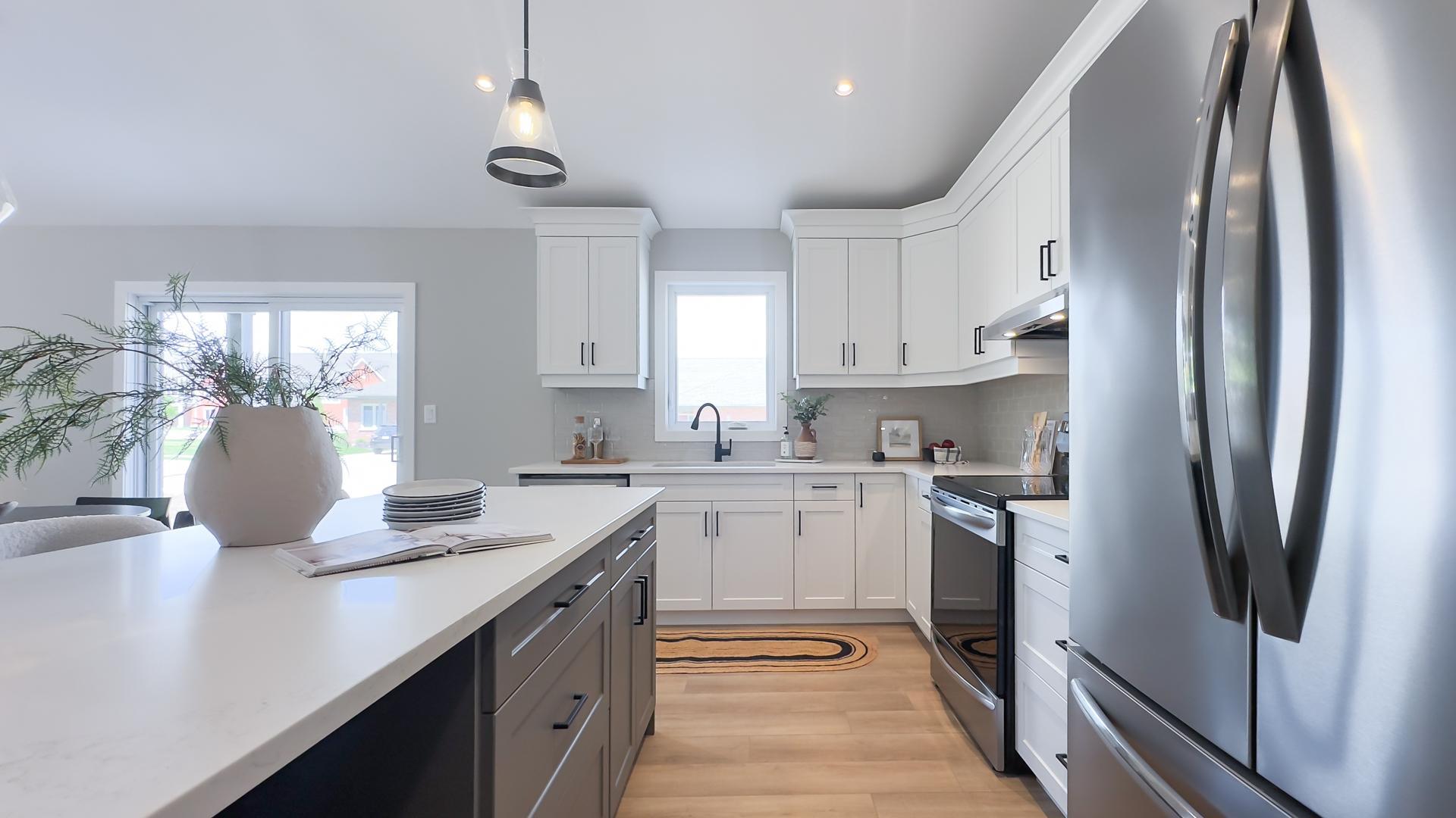 Modern kitchen with large island and quartz countertops
