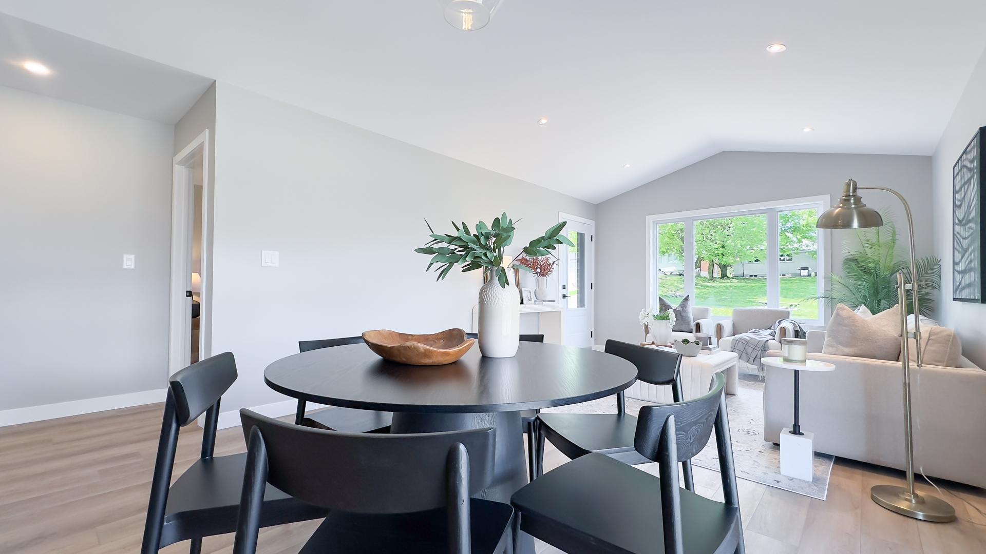 Dining area with open concept layout and natural light