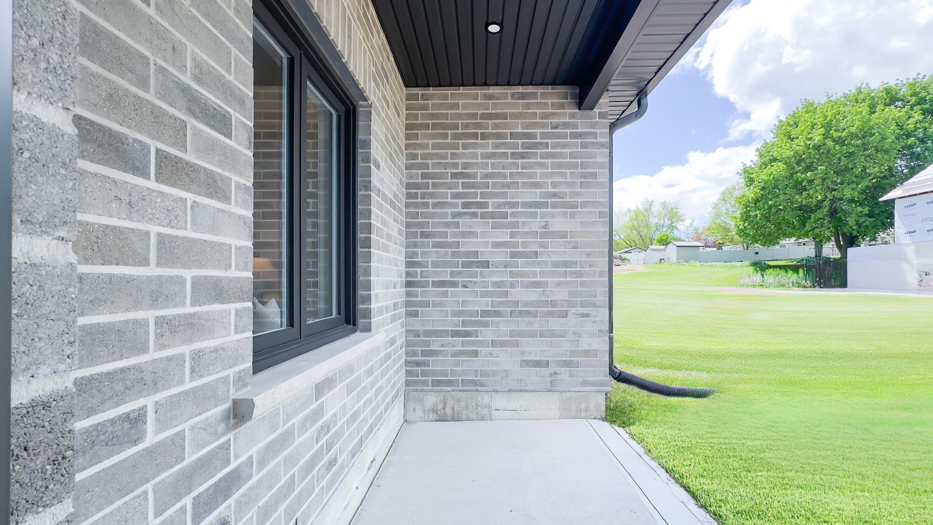 Thornden custom home exterior with stone and siding