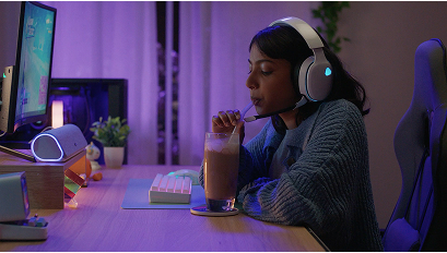 A tall building with an advertisement a rock climbing wall, a man standing on top, and the slogan "You're gonna need Milk for that. Got Milk?" 