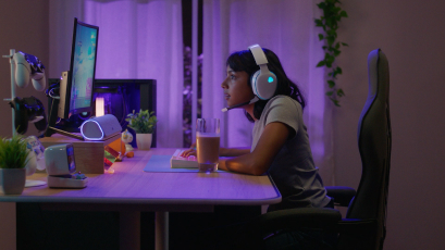 A tall building with an advertisement a rock climbing wall, a man standing on top, and the slogan "You're gonna need Milk for that. Got Milk?" 