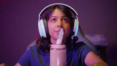 A tall building with an advertisement a rock climbing wall, a man standing on top, and the slogan "You're gonna need Milk for that. Got Milk?" 