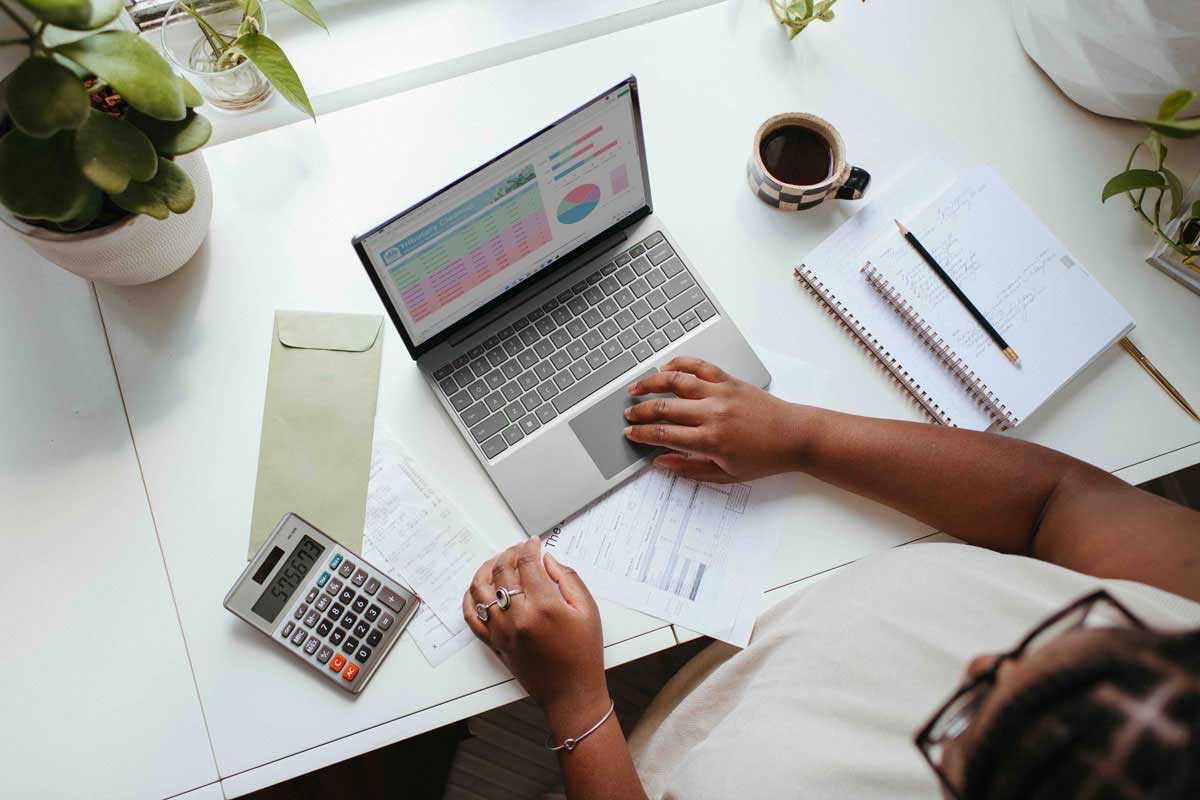 A woman is working on a computer