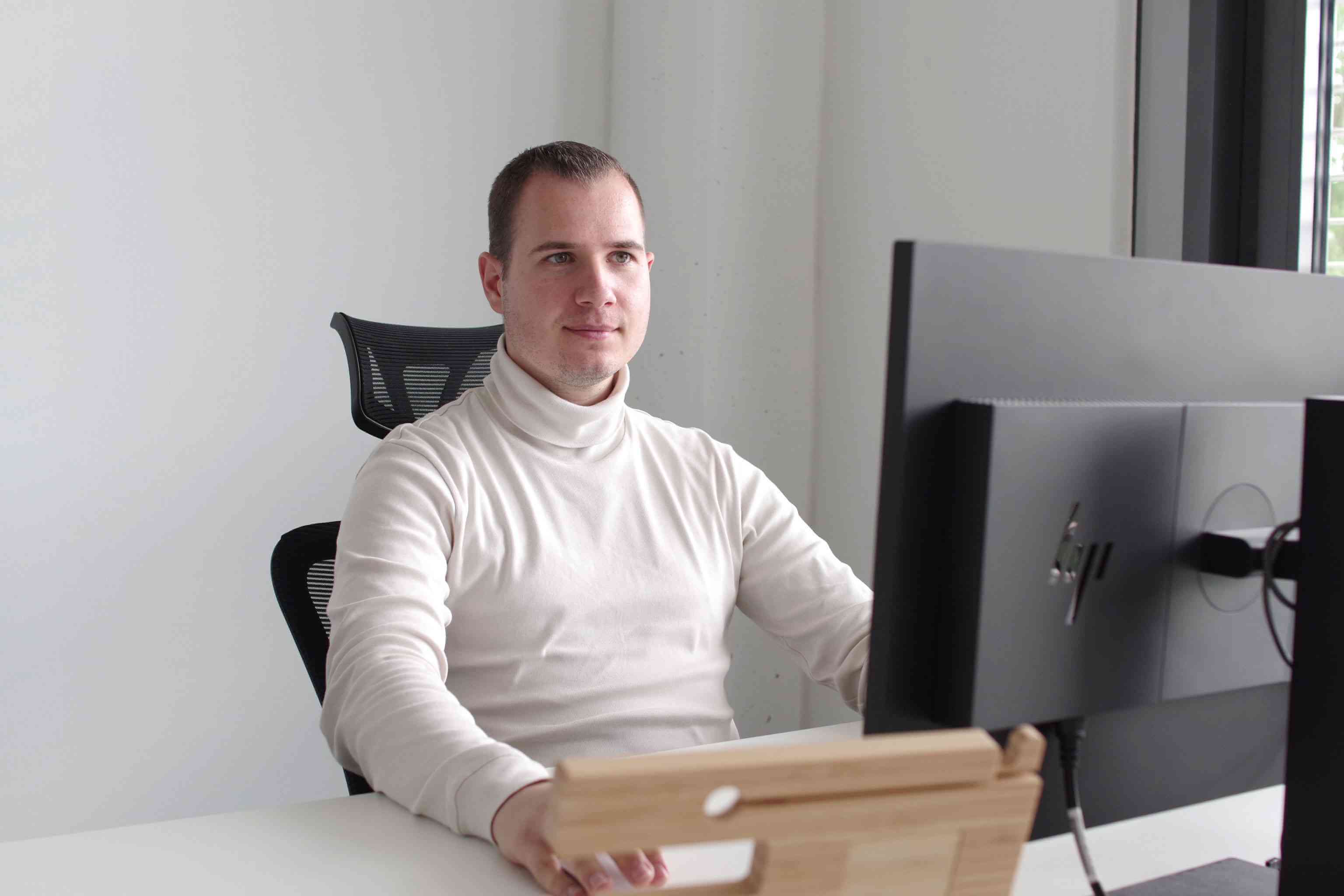 Adrian working at the office