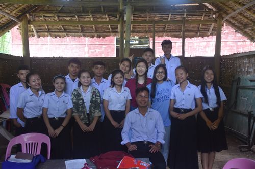 Students posing for a picture in a classroom