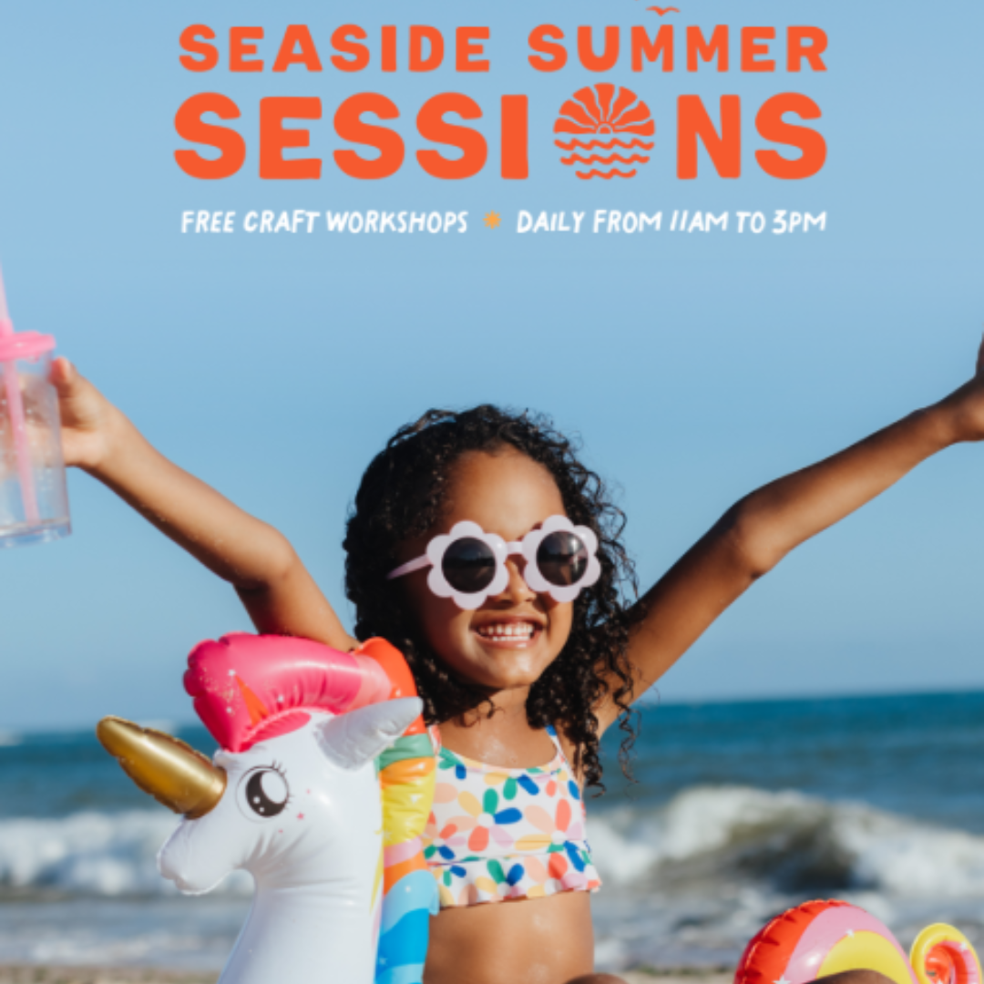 Girl by the beach with sunglasses on