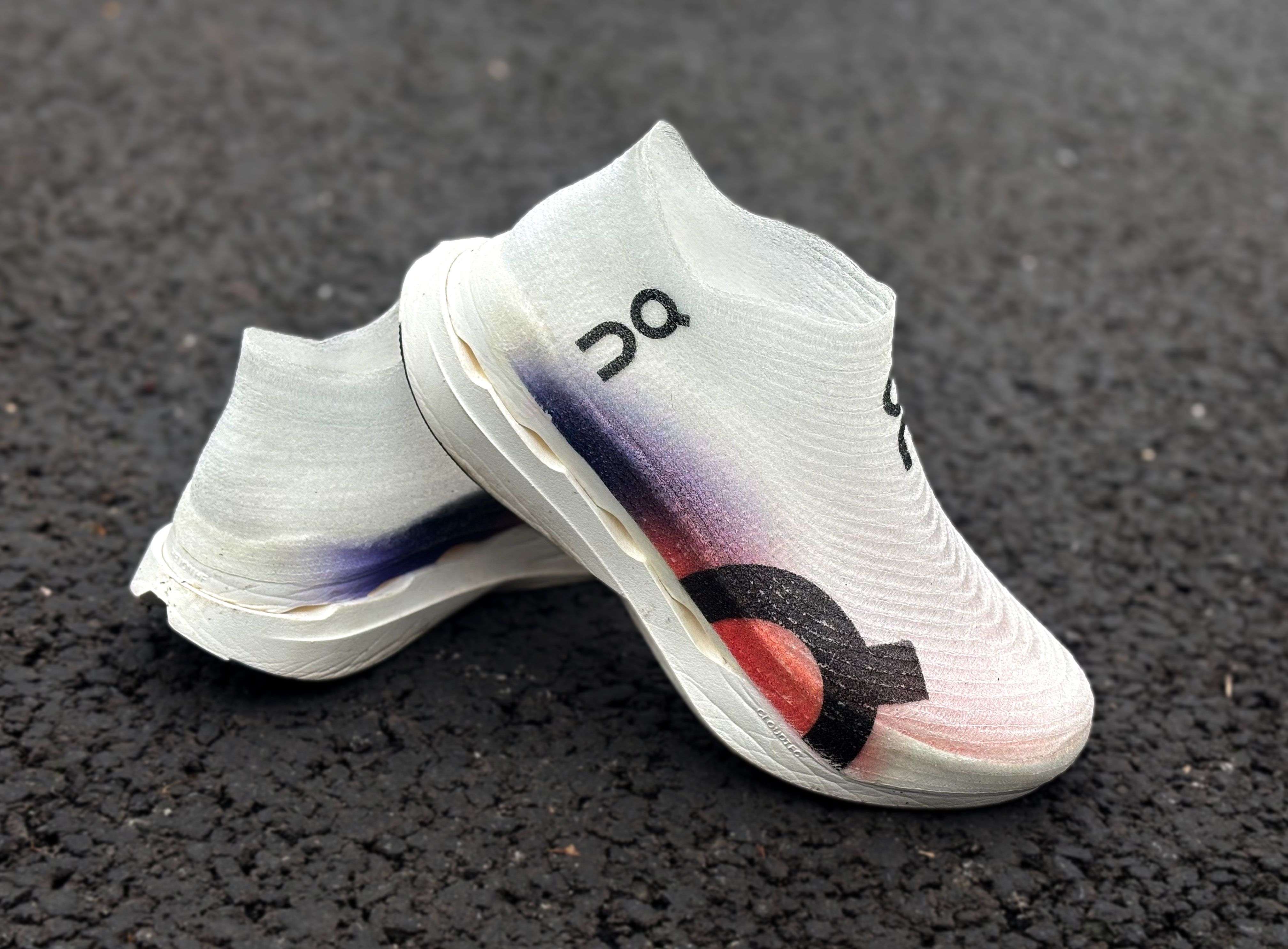 On Cloudboom Strile LS side view showing lightspray technology up close and the helion hyperfoam creases