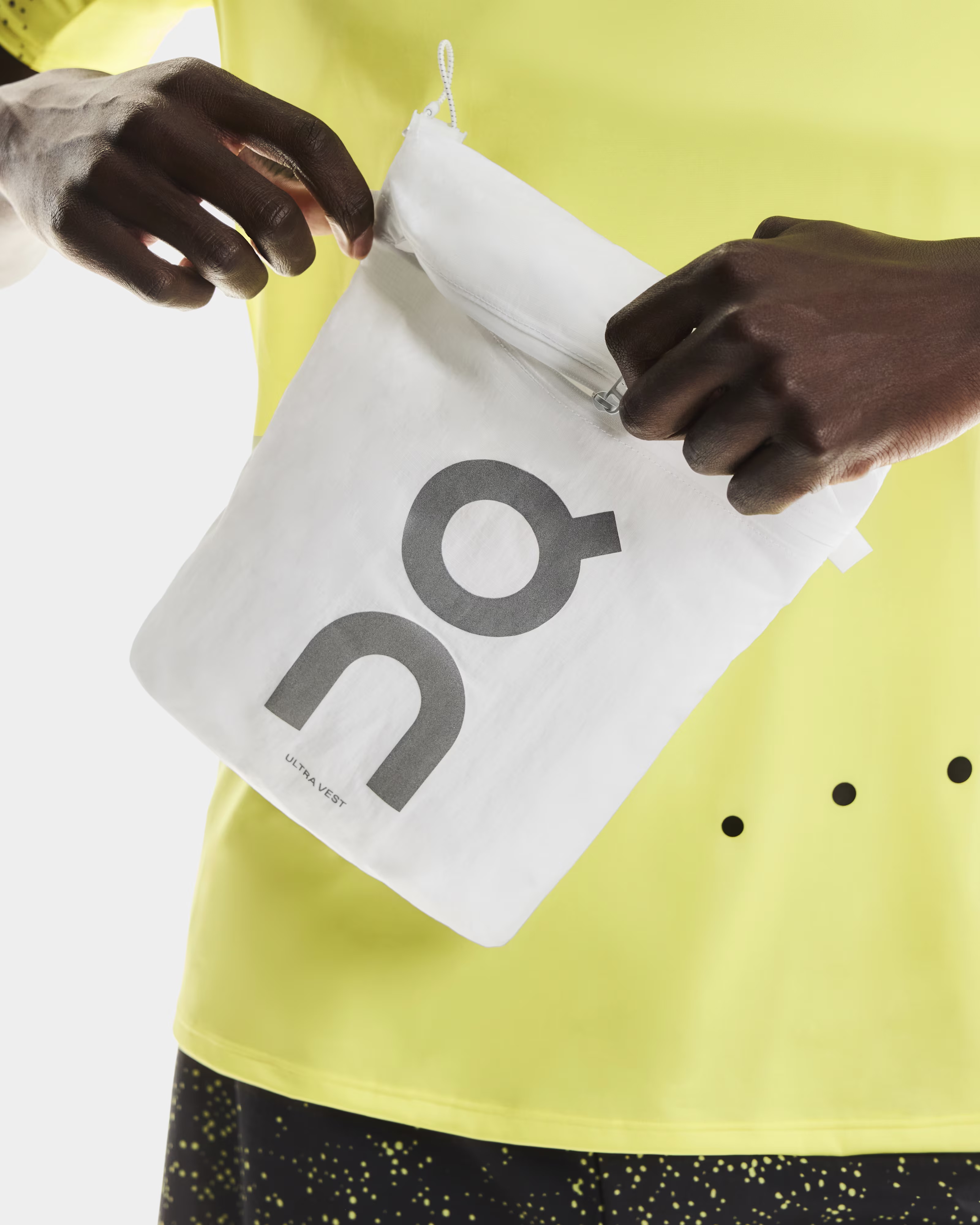 Image of On's Ultra Vest Pro being stored away in a small bag
