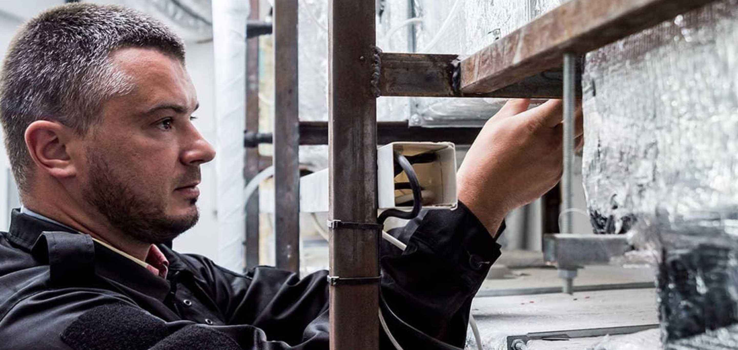 System Hygienics employee working on ductwork