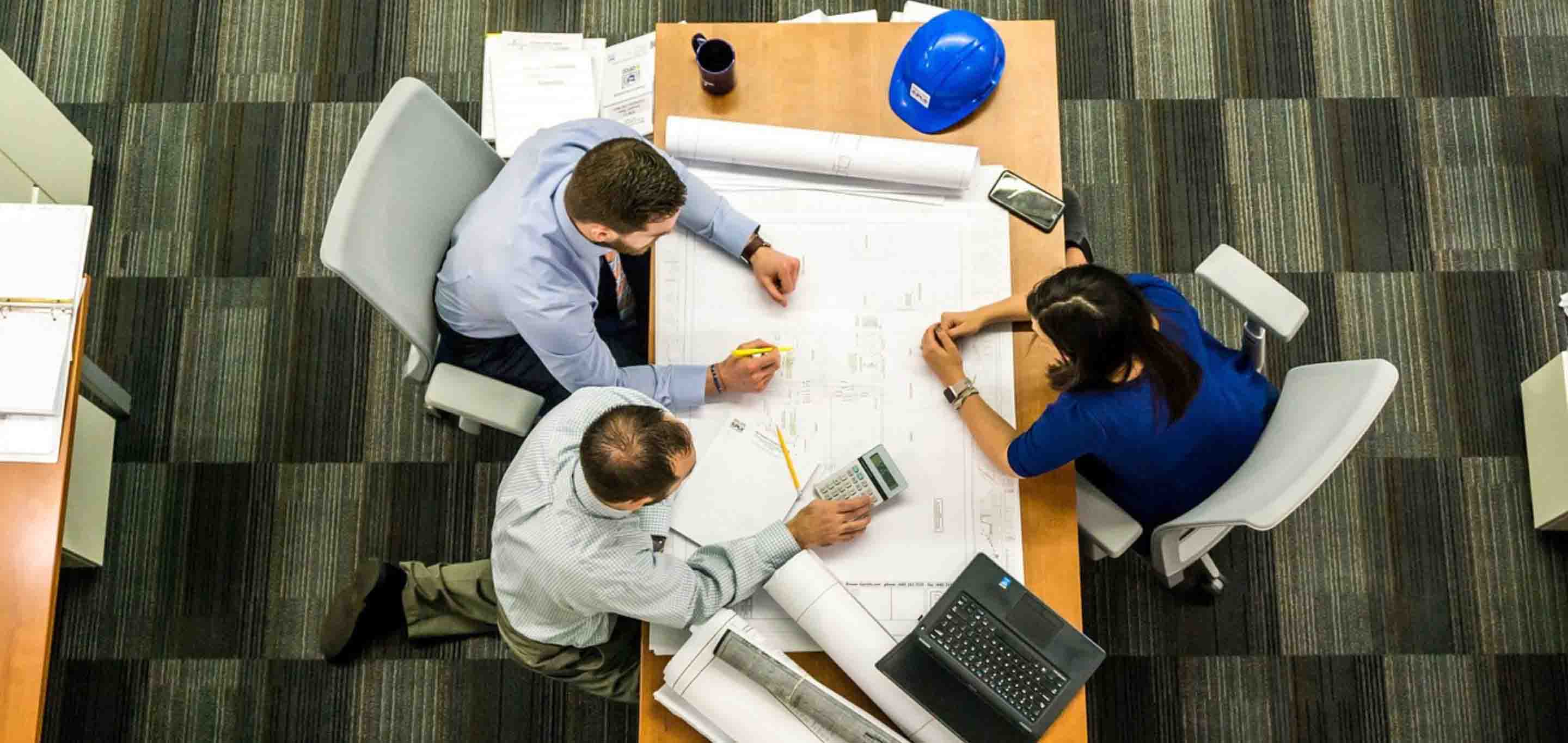 People sat around a table in an office