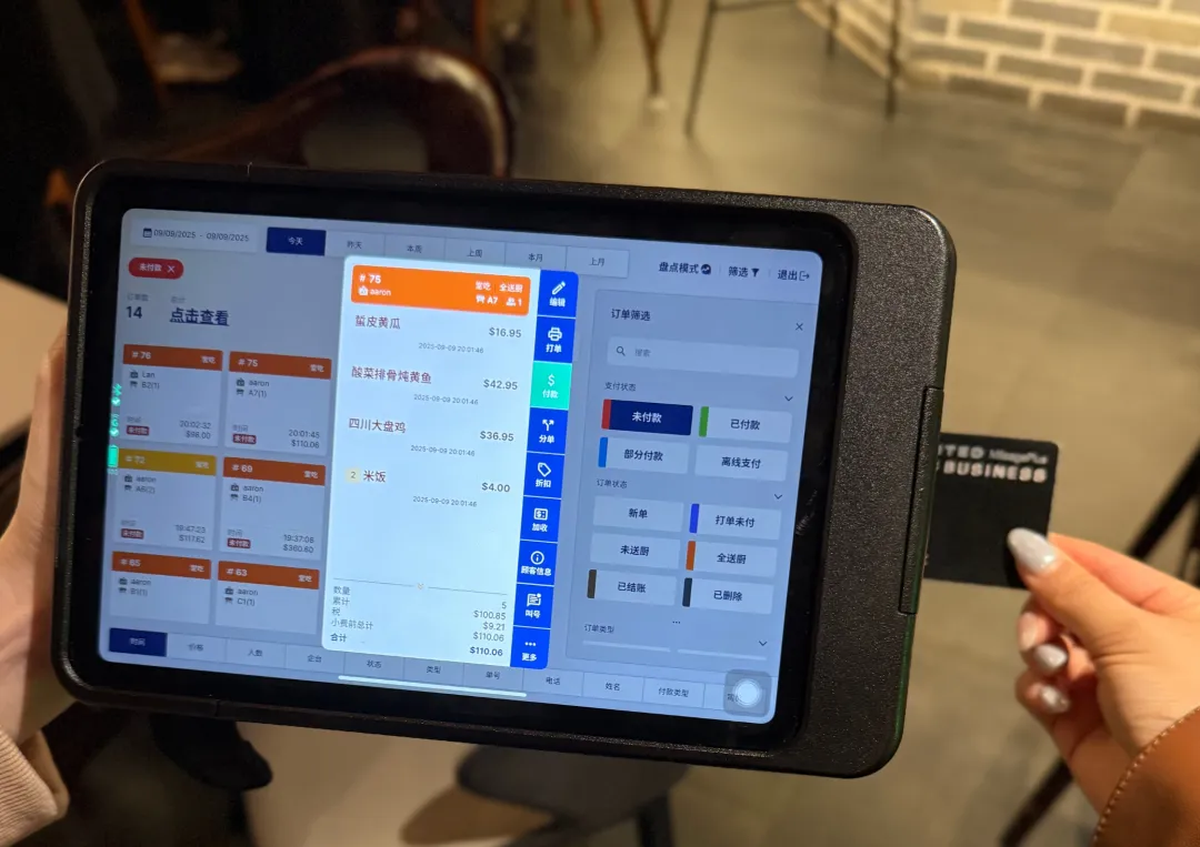 A server at Imperial Treasure uses the MenuSifu POS Pay Pad to take tableside orders and process payments directly at the table, enabling faster service and a seamless guest checkout experience.