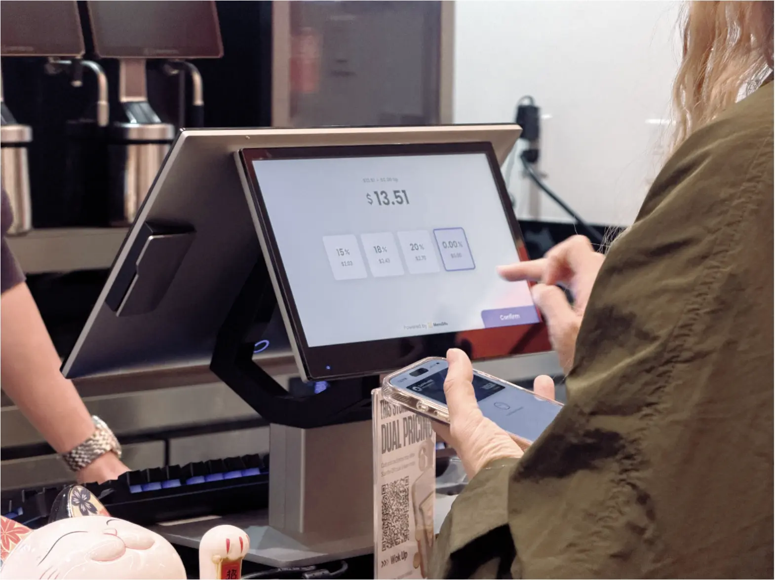 A restaurant customer completing payment on the MenuSifu POS system touchscreen, showing tip options and digital checkout interface.