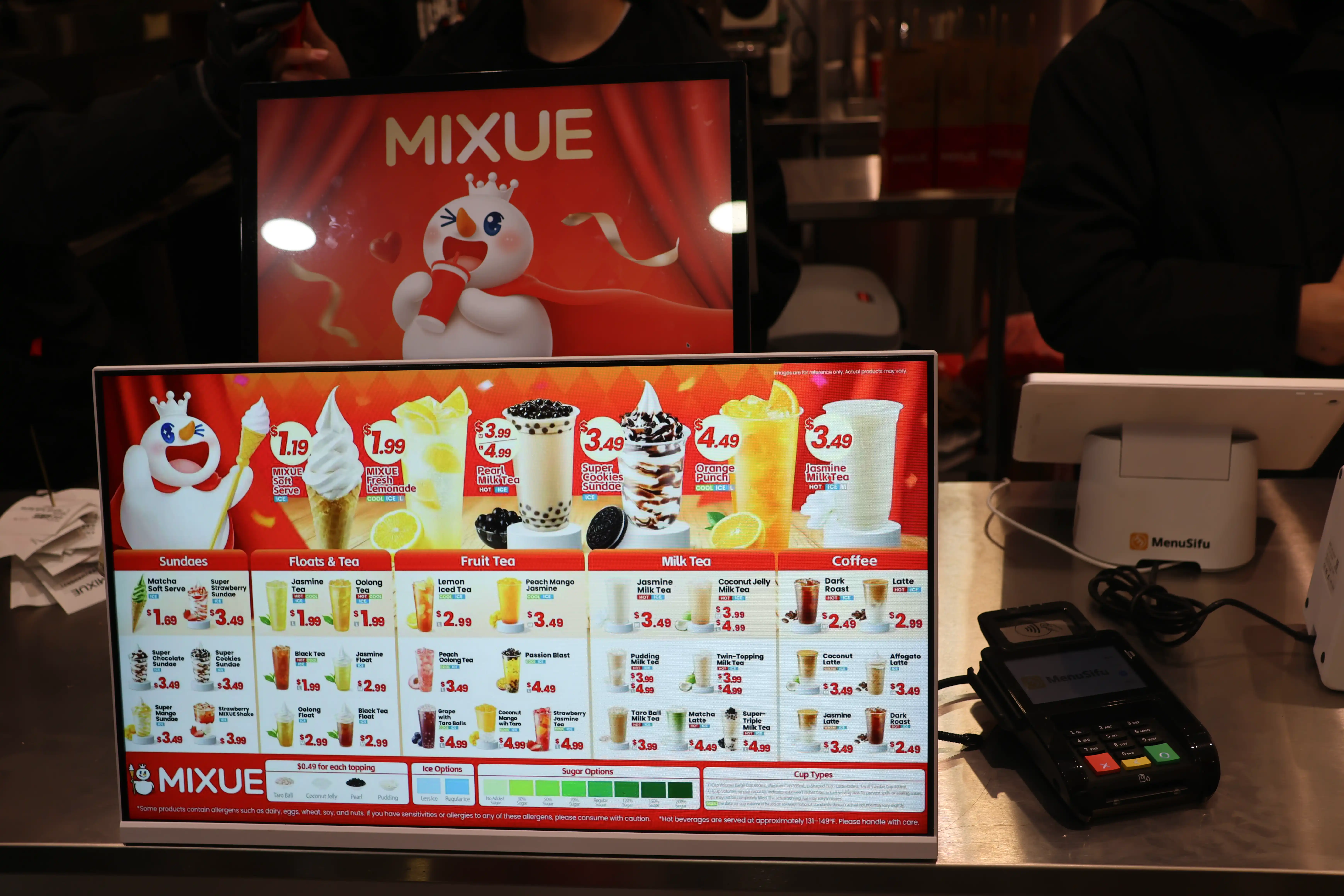 Digital menu screens and MenuSifu POS system inside a MIXUE U.S. store, showcasing ultra-affordable beverages and localized restaurant technology supporting MIXUE’s expansion in the United States.