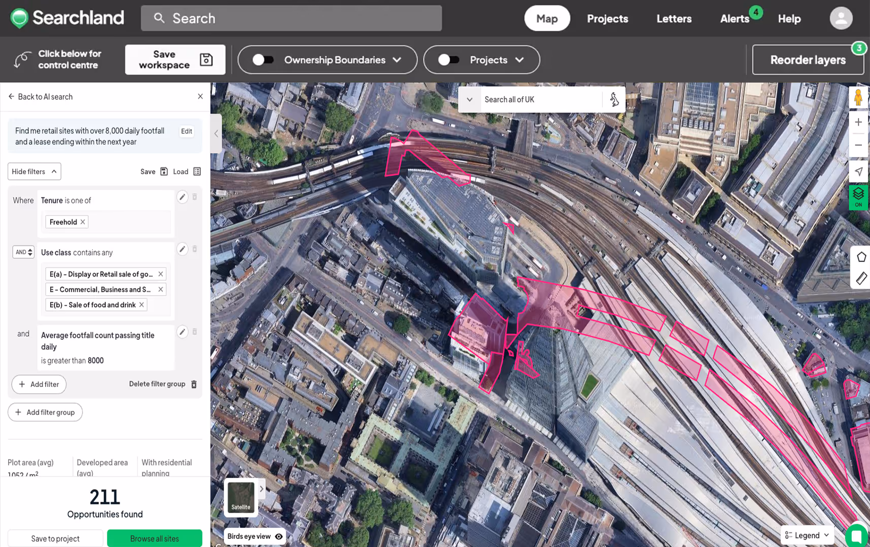 Satellite map interface showing an urban area with train tracks and buildings, highlighted retail sites outlined in pink, and filters for retail site search on the left panel.