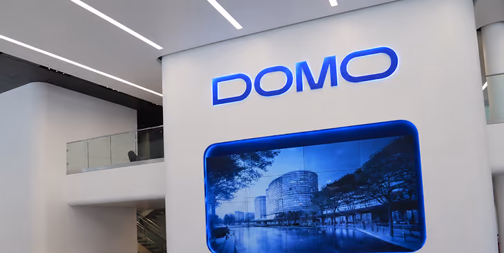 Large white sign with blue text reading DOMO.