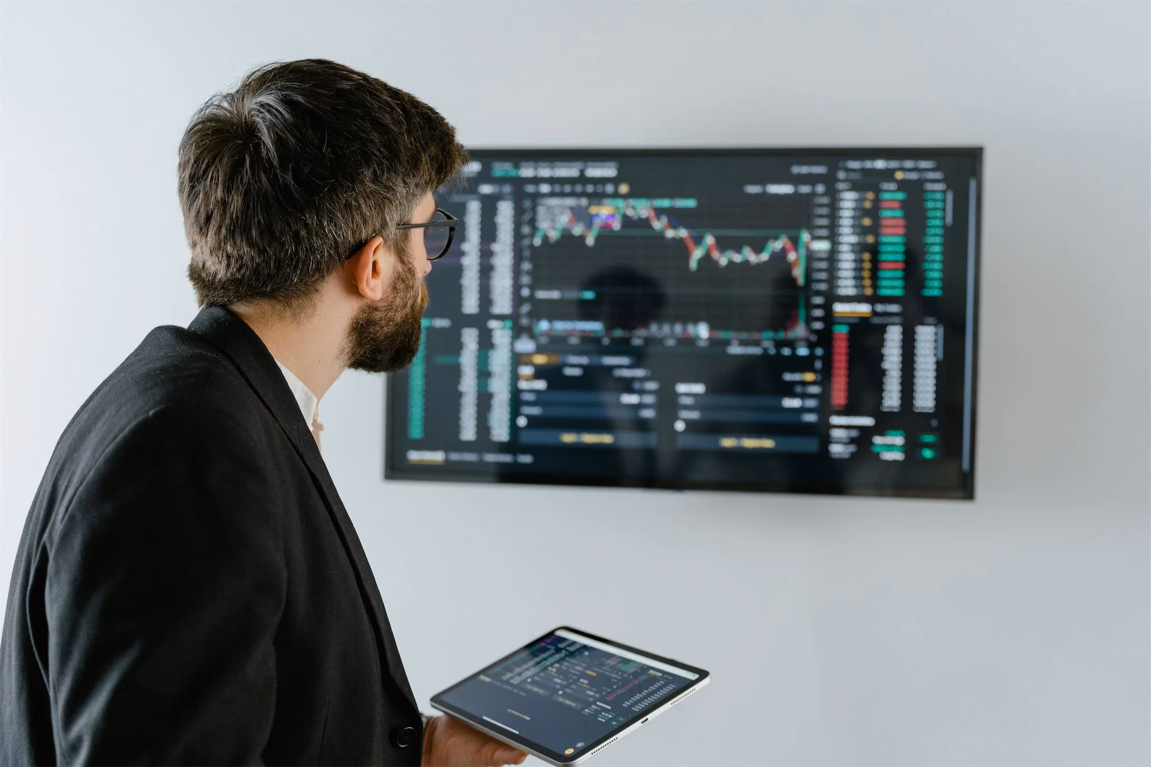 A man looks at investment data software.