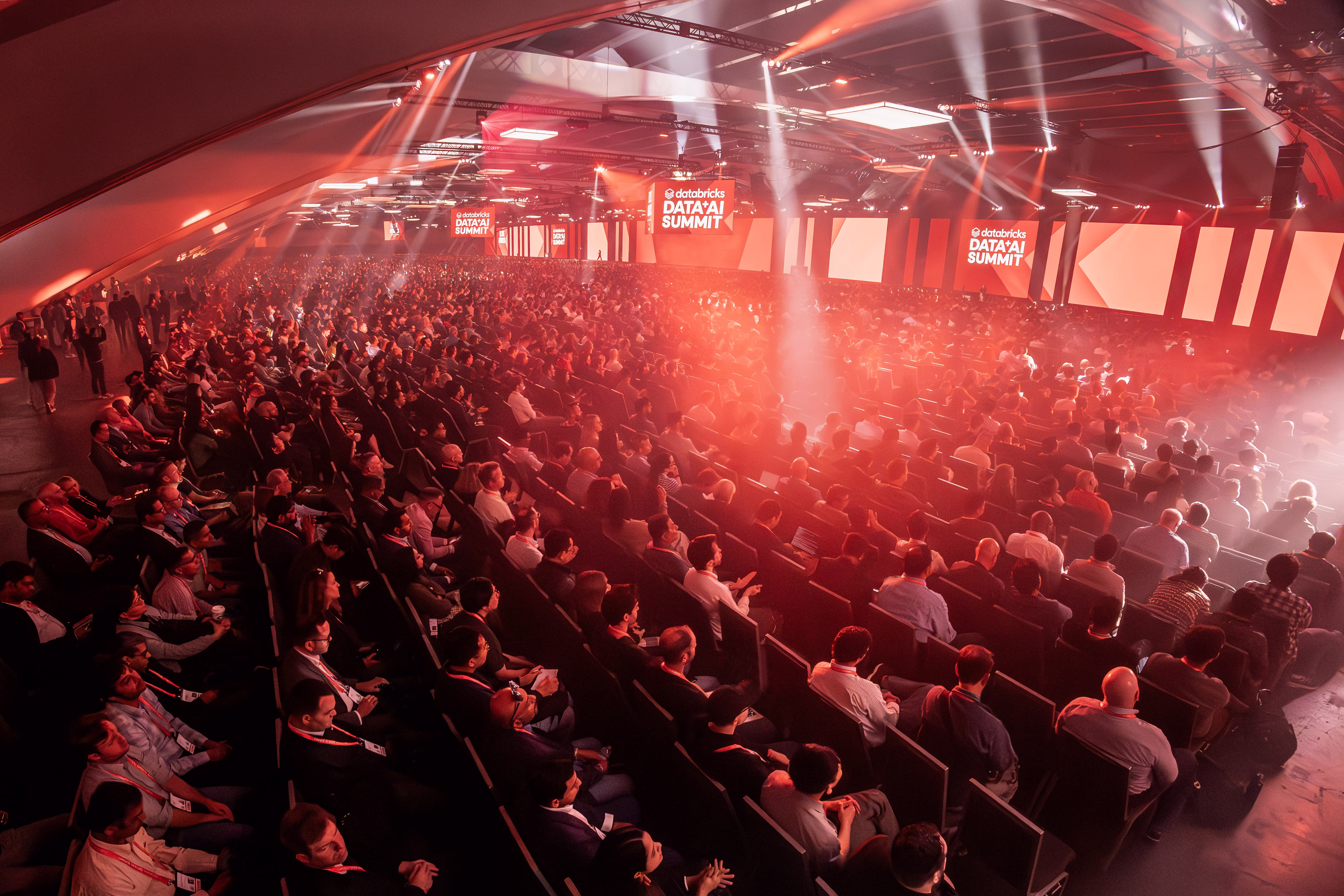 Attendees at the Databricks Data + AI Summit 2026 listen to a keynote announcement on major product releases.