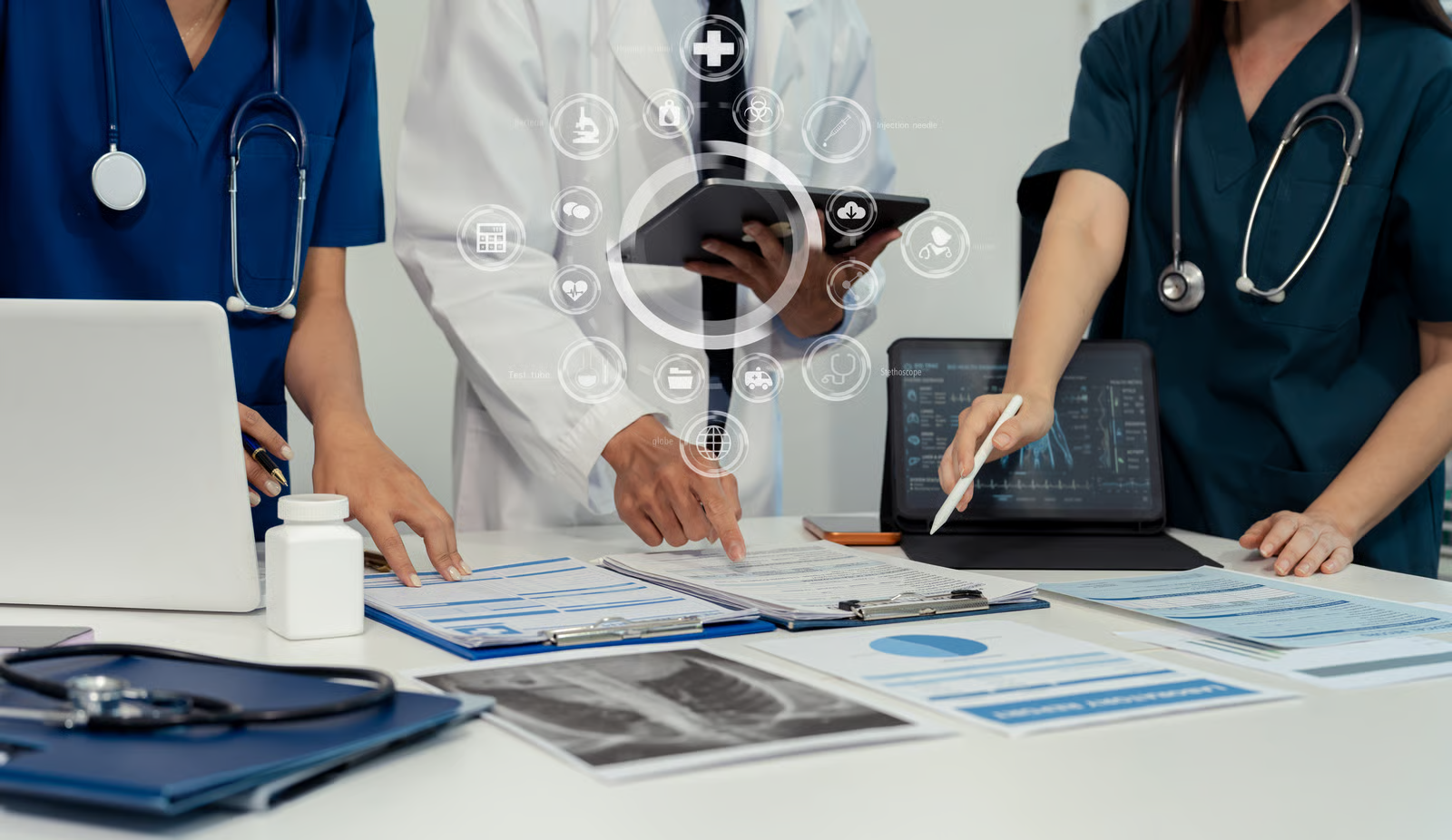 Healthcare team reviewing patient records and digital health data, illustrating healthcare software integration and clinical workflow management.