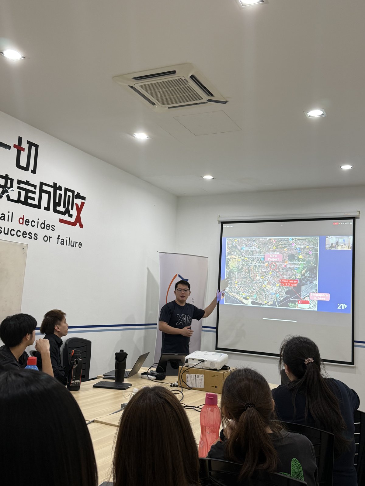 Speaker presenting The Address JB location map