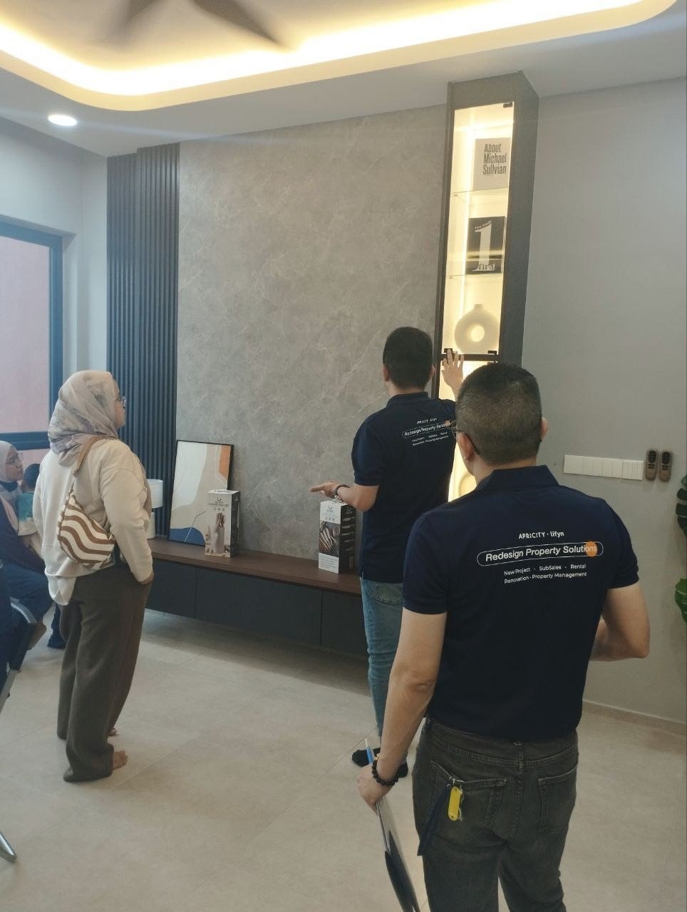 Guests exploring the living area of the Edgewood showroom